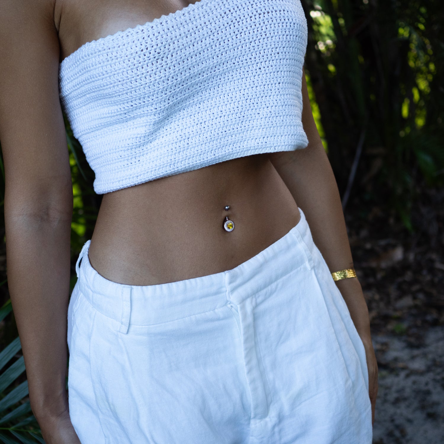 Sterling silver belly button piercing with oval citrine gemstone and CZ diamond halo in rose gold finish, vibrant yellow, sparkly style.