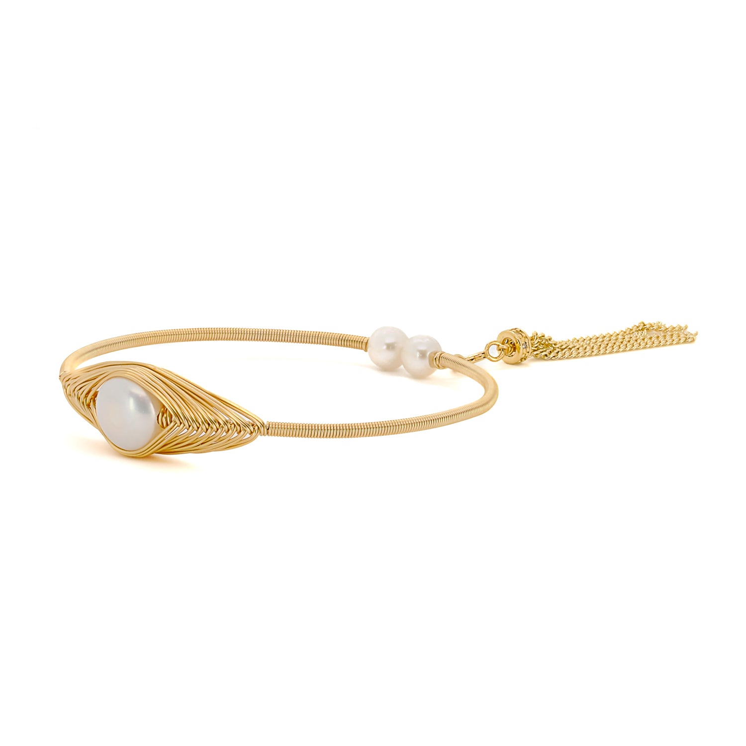 Opulent pearls and gold: Cleopatra-inspired bangle adds sophistication.