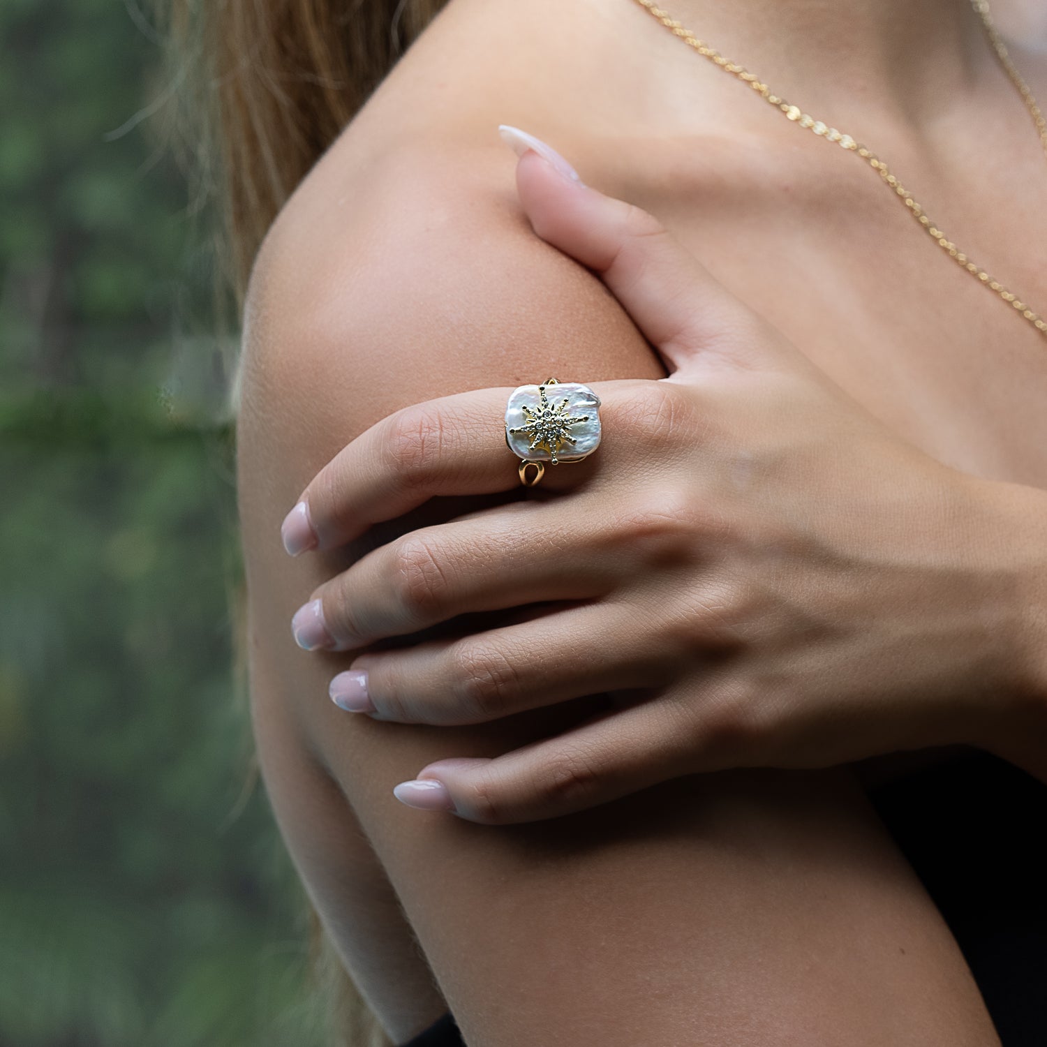 Channeling Cleopatra's allure: Model adorned with the elegant pearl ring.