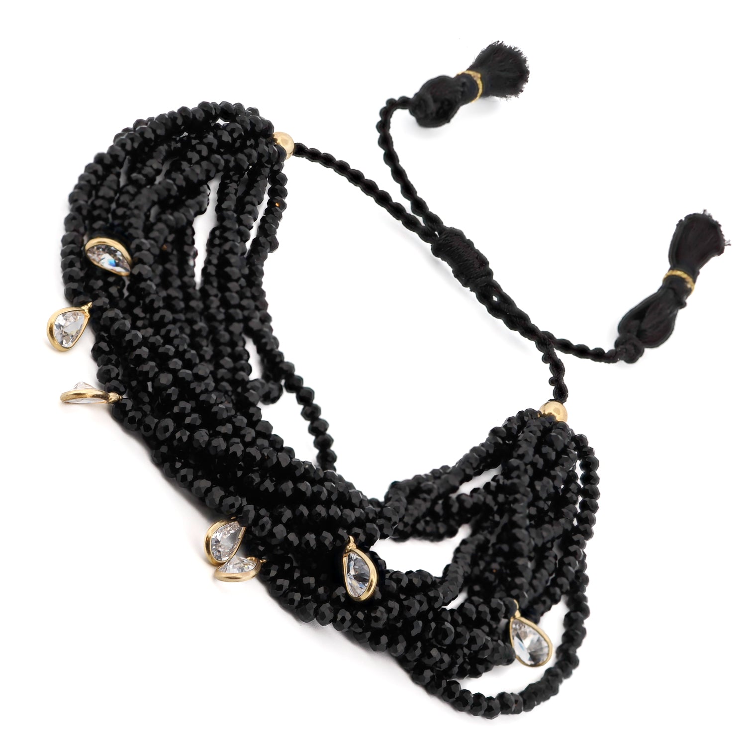 Handcrafted black crystal bracelet with silver and Swarovski charms, featuring tassels for a bohemian touch