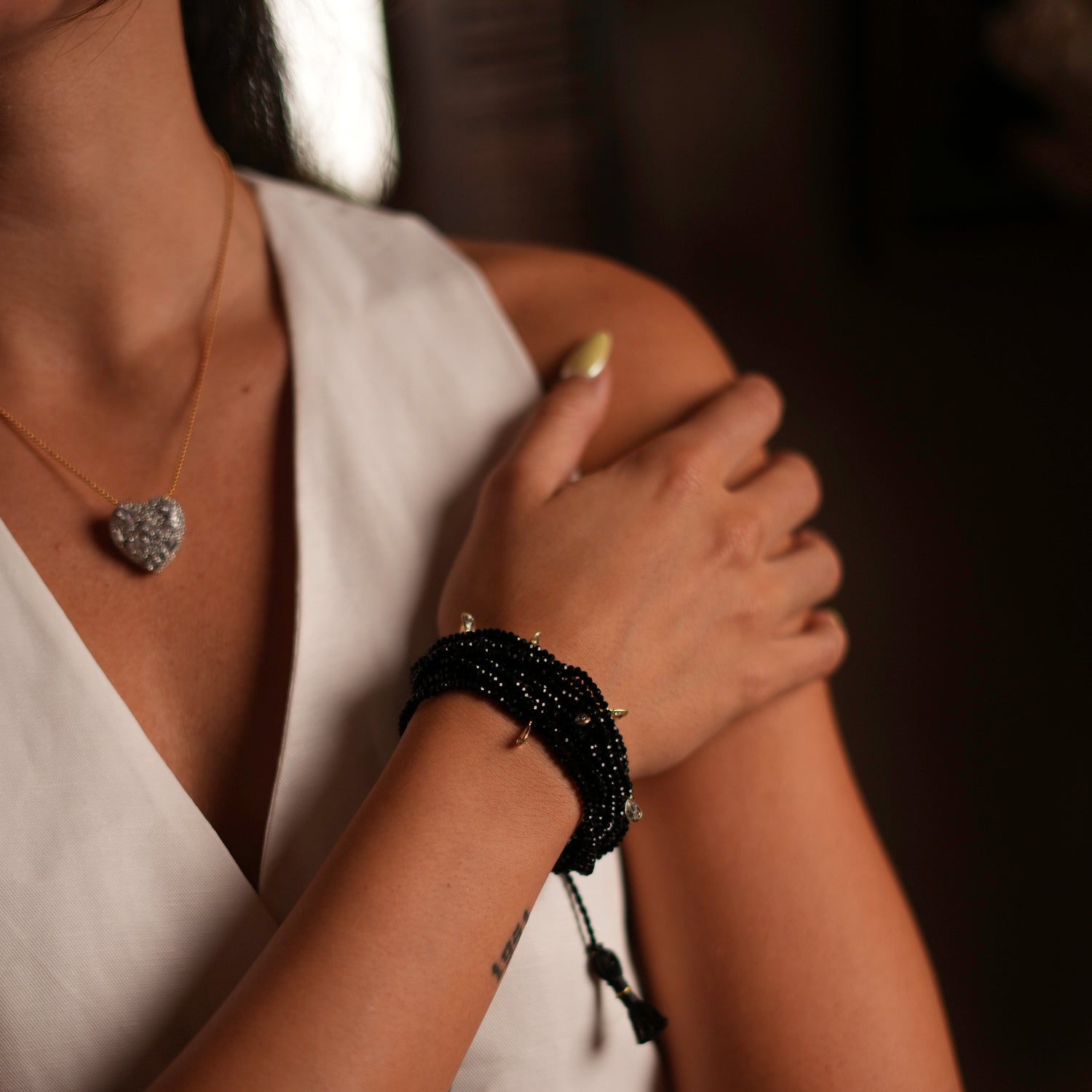 Elegant black crystal bead bracelet with sterling silver and Swarovski accents, featuring adjustable strands