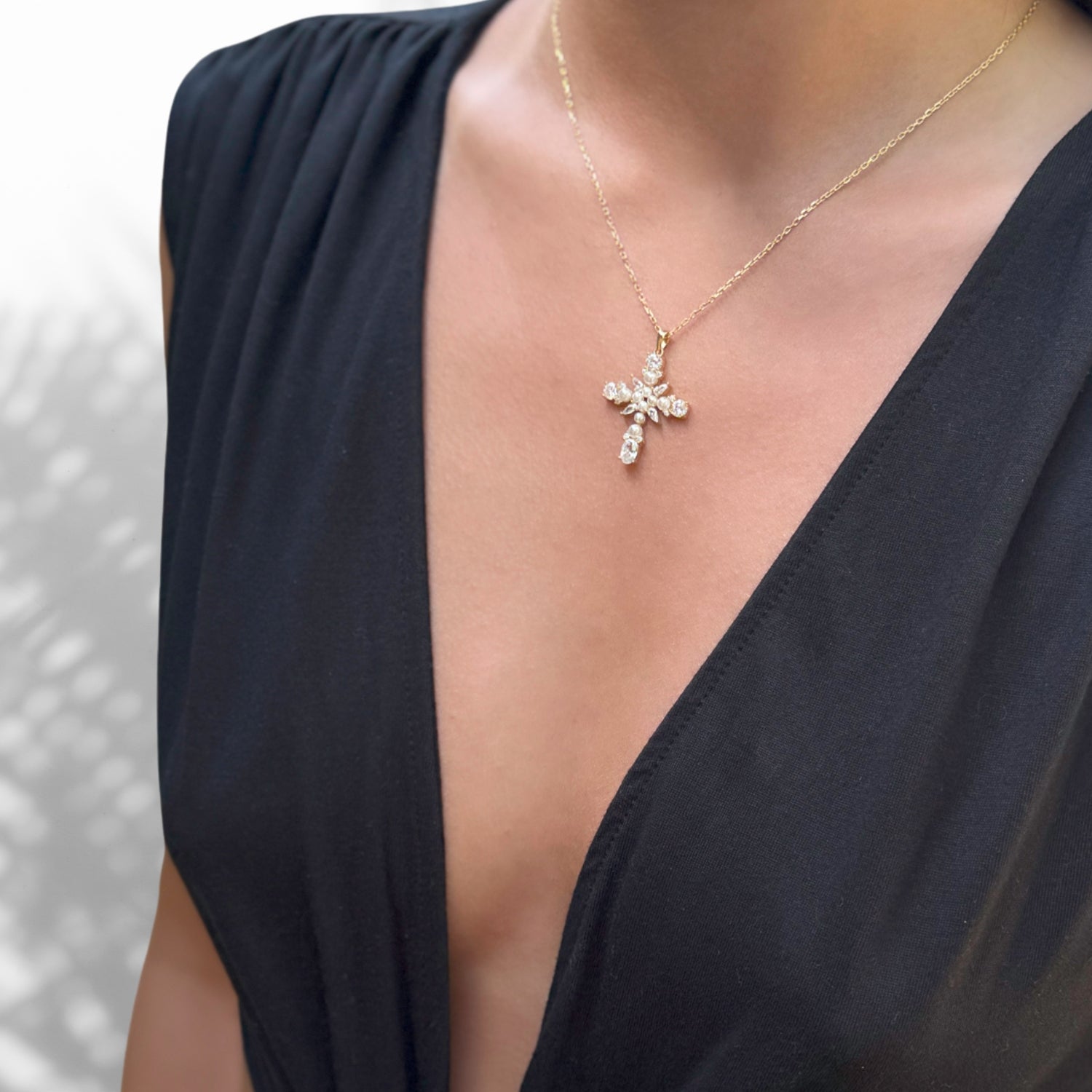 Model Wearing Sophisticated Pearl Stone Cross Pendant Necklace