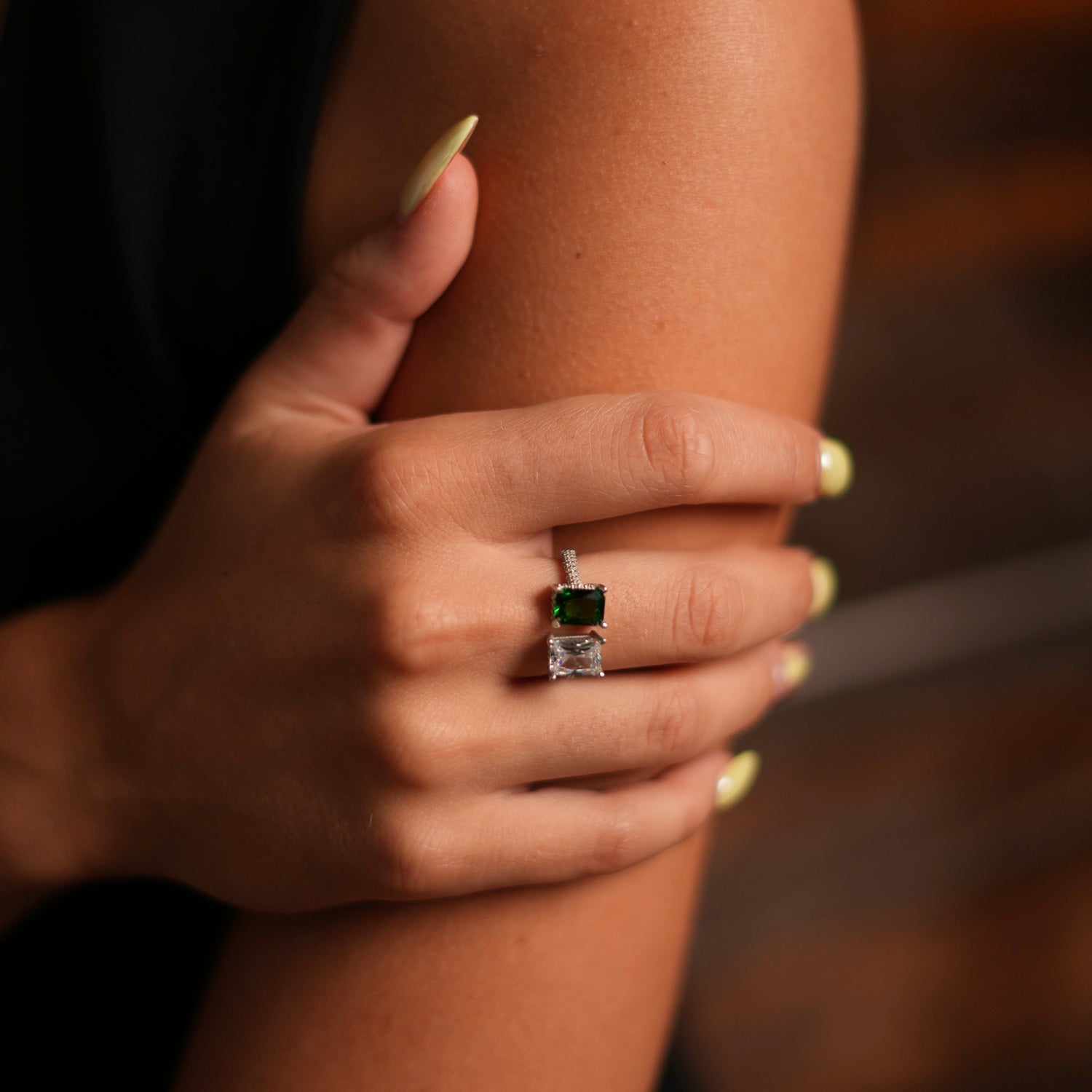 Sterling silver ring with an emerald and diamond design, enhanced by CZ diamonds