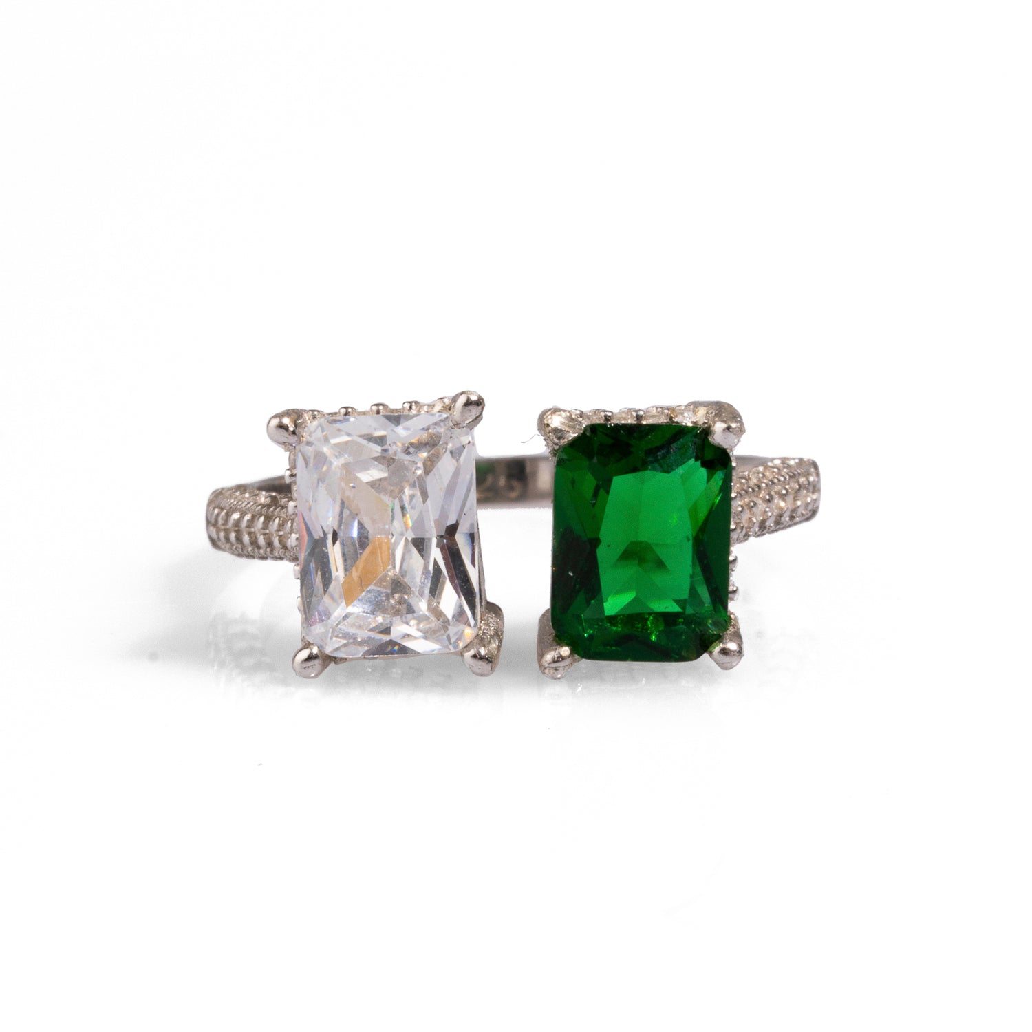 Elegant sterling silver statement ring featuring a dazzling emerald and diamond, adorned with additional CZ diamonds