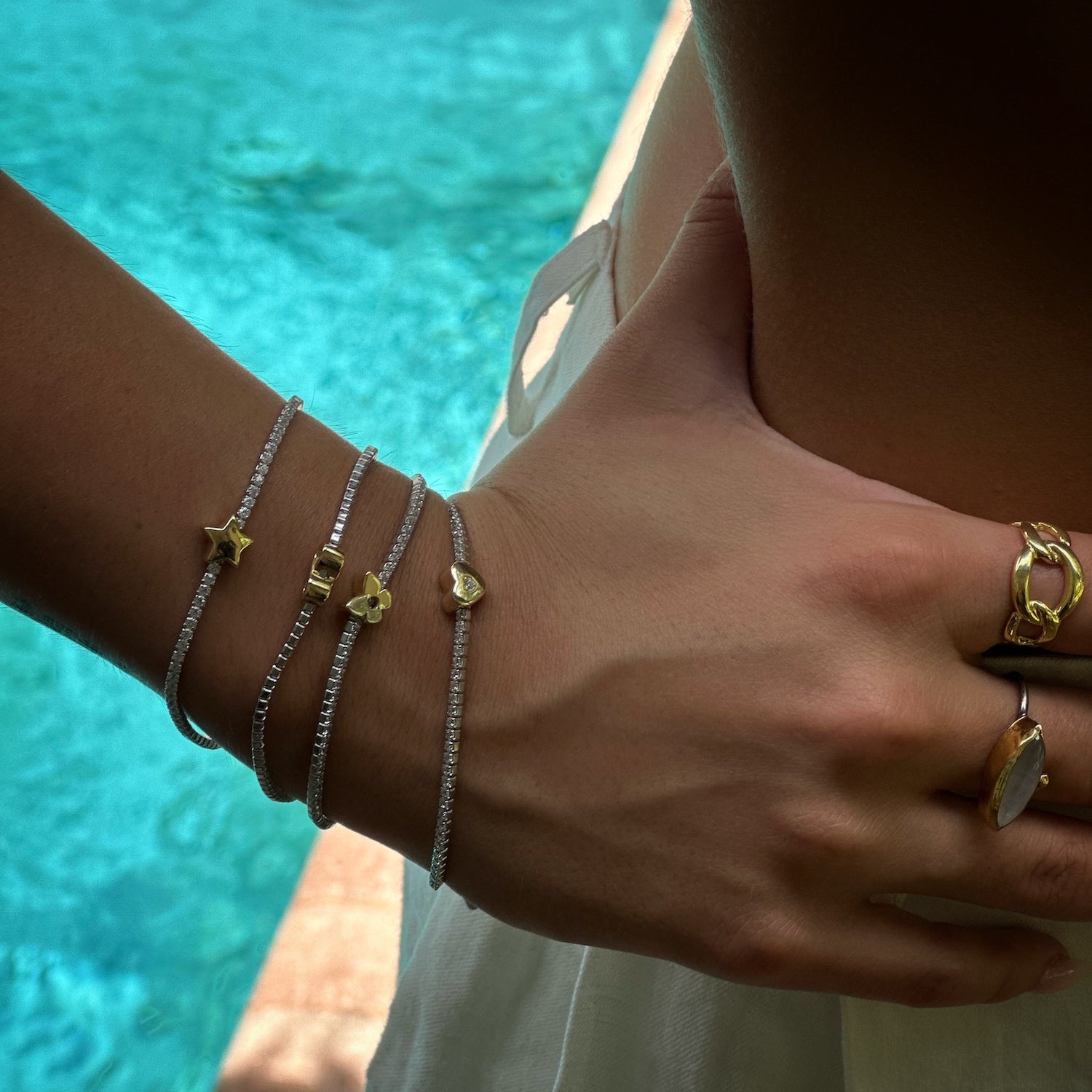 Sparkling charm: Model showcases Gold Butterfly Diamond Tennis Bracelet.