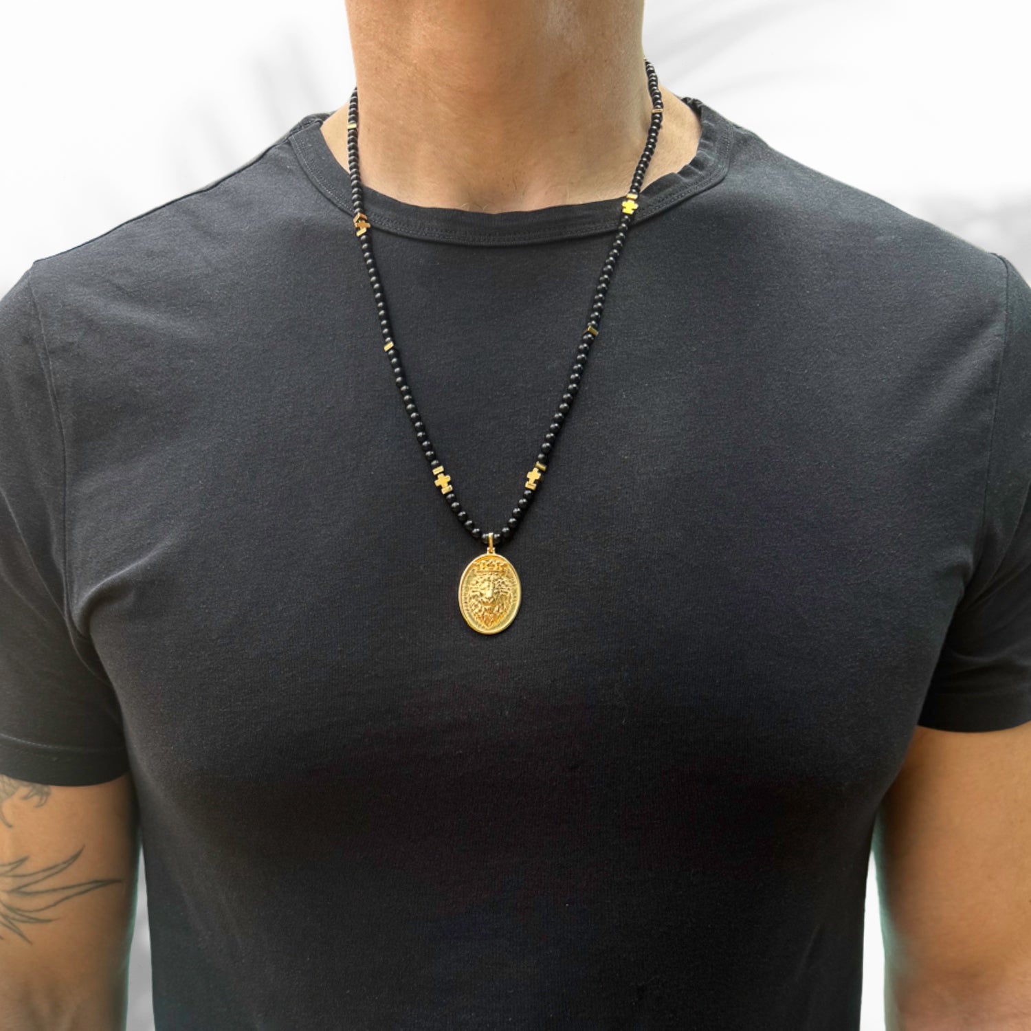Handcrafted men's necklace with protective black onyx beads and a 24k gold-plated lion pendant on 925 sterling silver