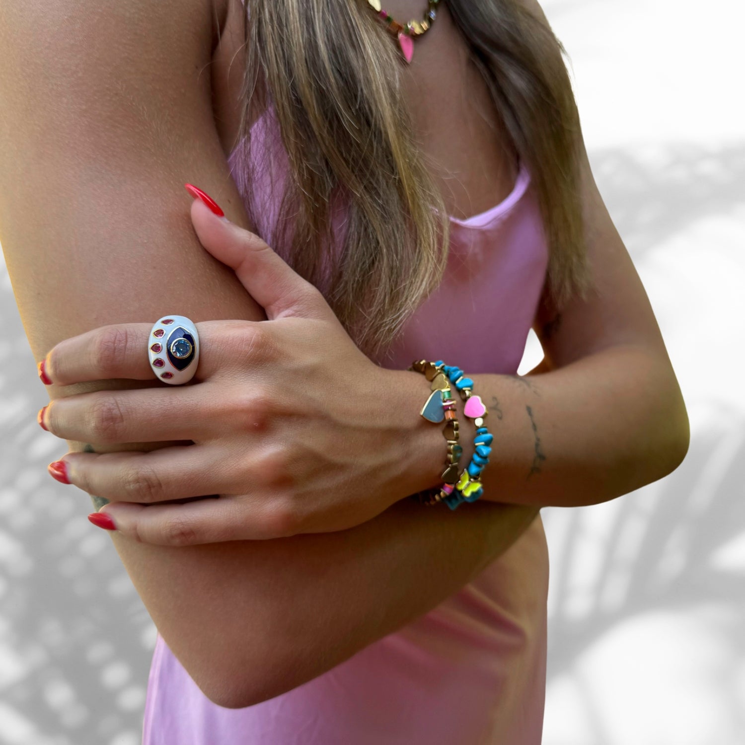 Elegant white enamel Evil Eye ring with Blue Topaz and Ruby stones on an adjustable gold band