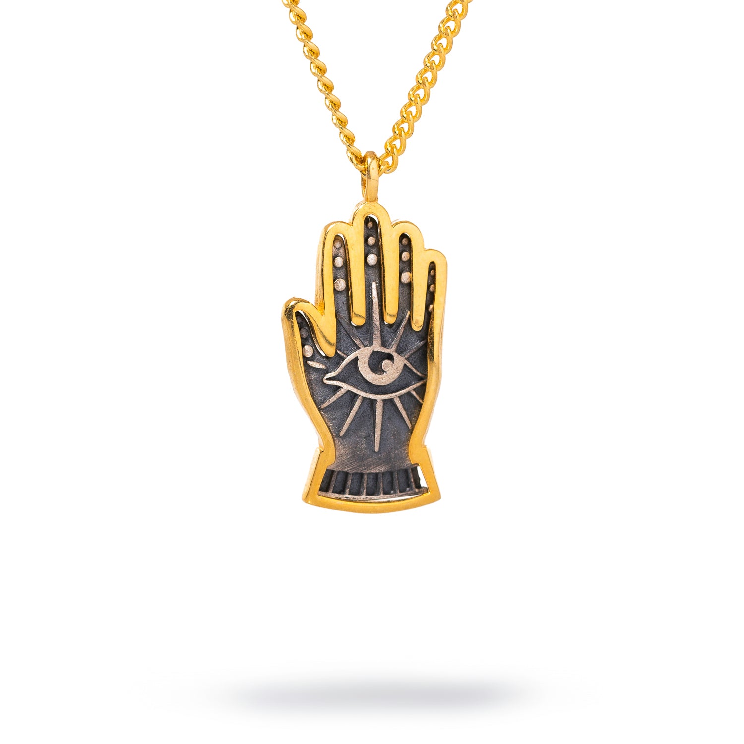 Minimalist sterling silver necklace with a gold-plated hand pendant adorned with an evil eye, designed for daily wear and spiritual protection.