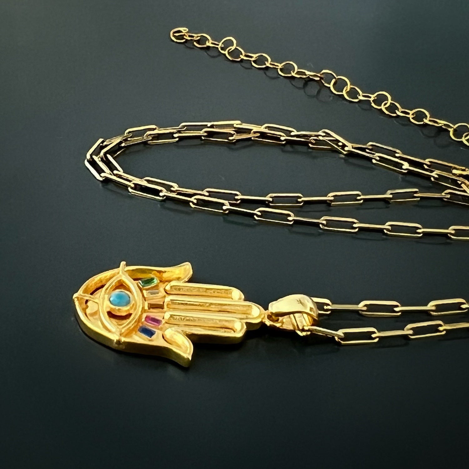 Zircon Hamsa Pendant Necklace - Make a statement with this gold necklace featuring a Hamsa pendant embellished with multicolor zircon stones, radiating elegance and spiritual significance.