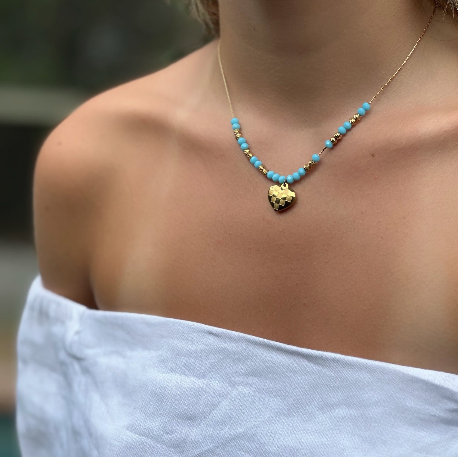 Handmade Beauty - Model Adorns Heart Pendant Turquoise &amp; Gold Necklace.