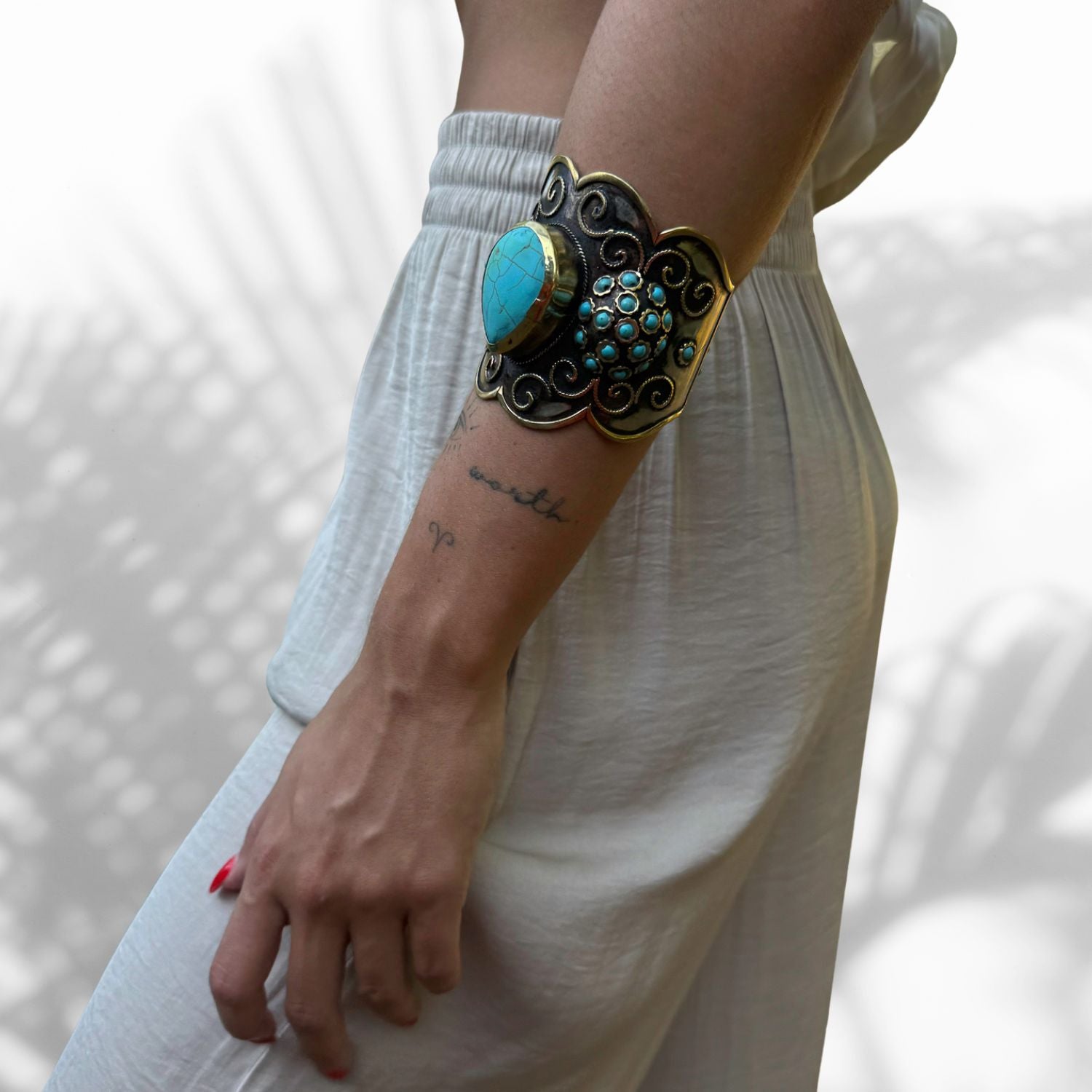 Model Wearing handmade adjustable bracelet with turquoise stones and vintage silver