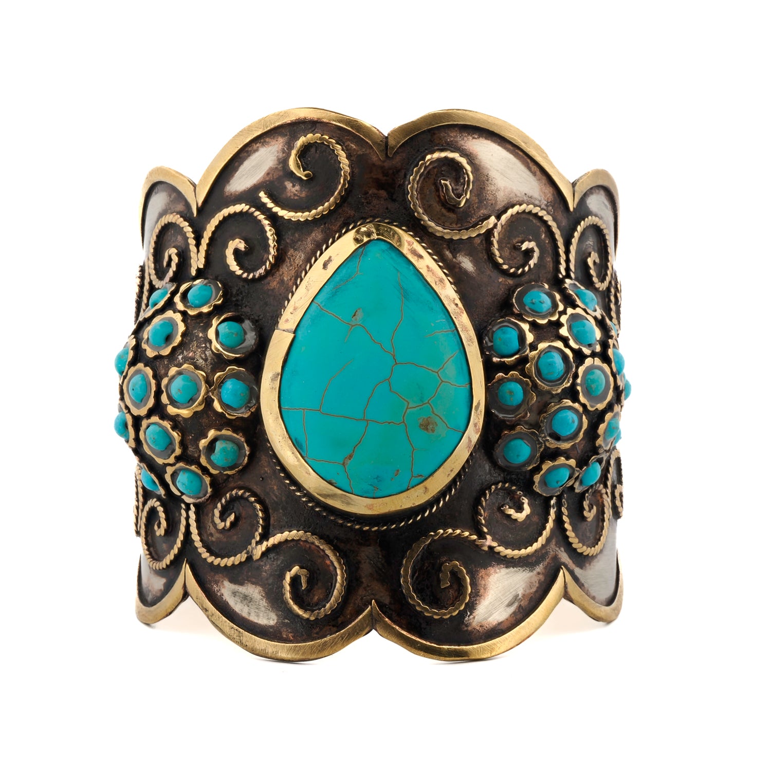 Teardrop-shaped turquoise gemstone with vintage silver and gold-plated designs