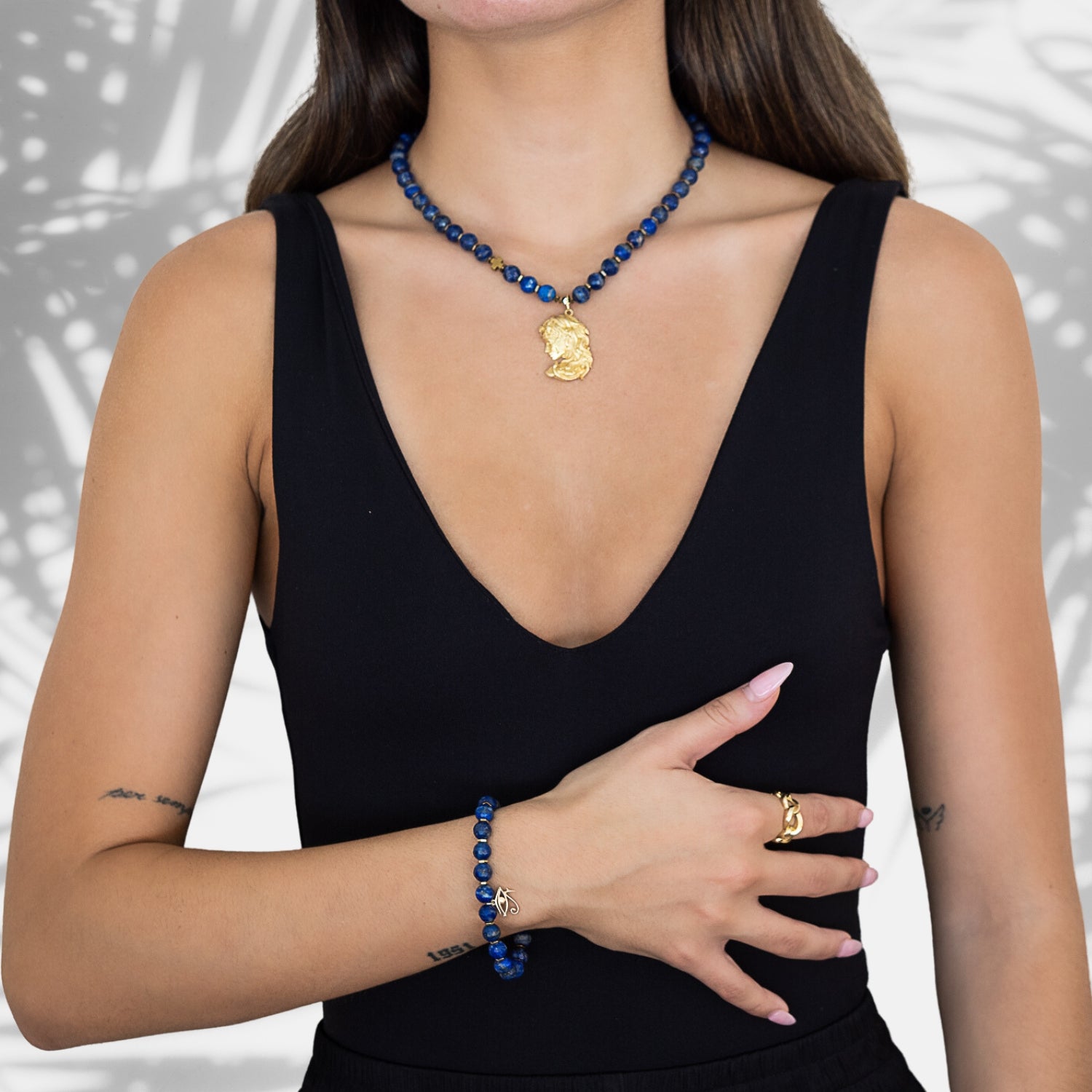 Witness the radiance of our model as she showcases the exquisite Medusa Lapis Lazuli Necklace.