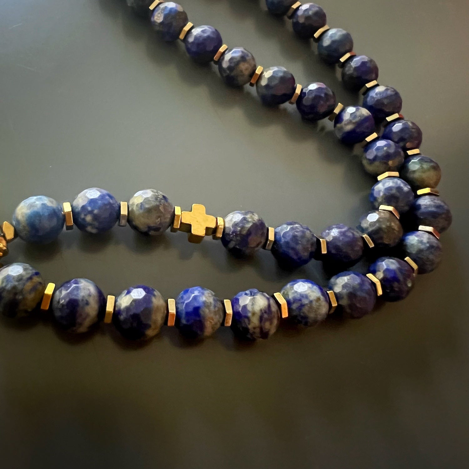 Indulge in the uniqueness of the Medusa Lapis Lazuli Necklace, showcasing lapis lazuli stone beads and intricate sterling silver detailing.