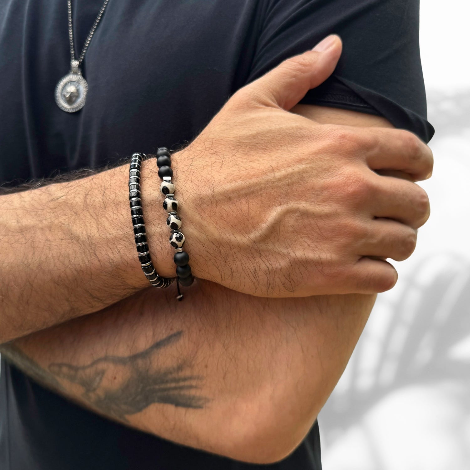 Handcrafted men's bracelet featuring black onyx stones and sleek silver hematite spacers for added elegance.