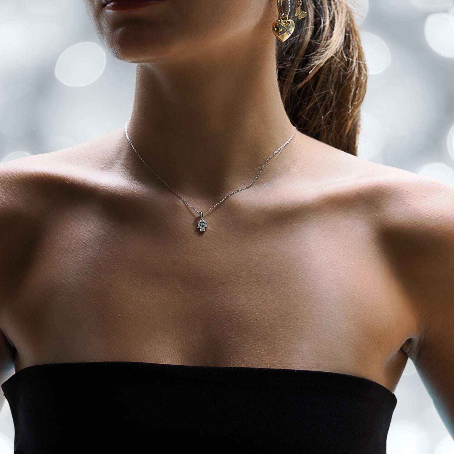 Model Wearing a Sterling Silver Hamsa Hand Necklace - A Symbol of Protection.