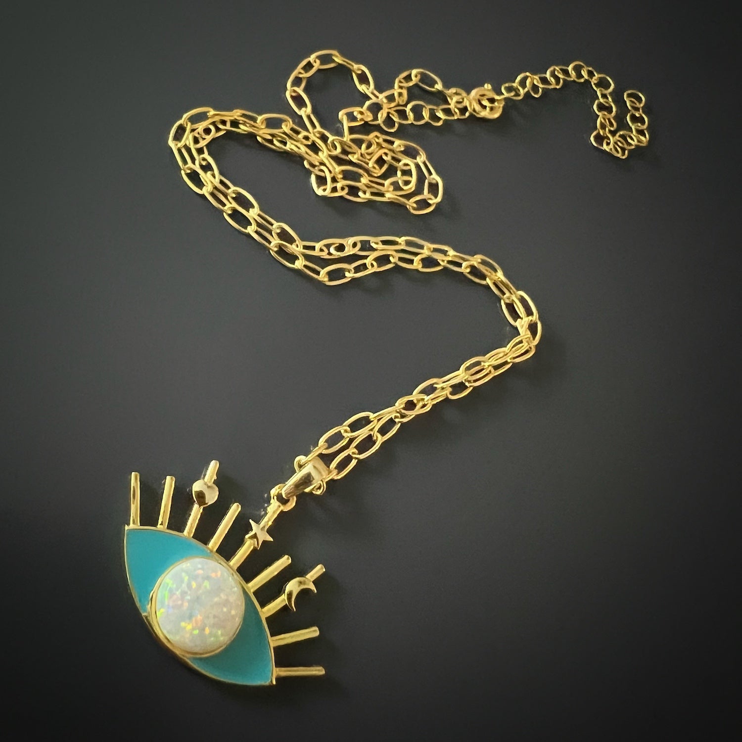 The Opal Turquoise Evil Eye Necklace, a powerful symbol of protection and style.