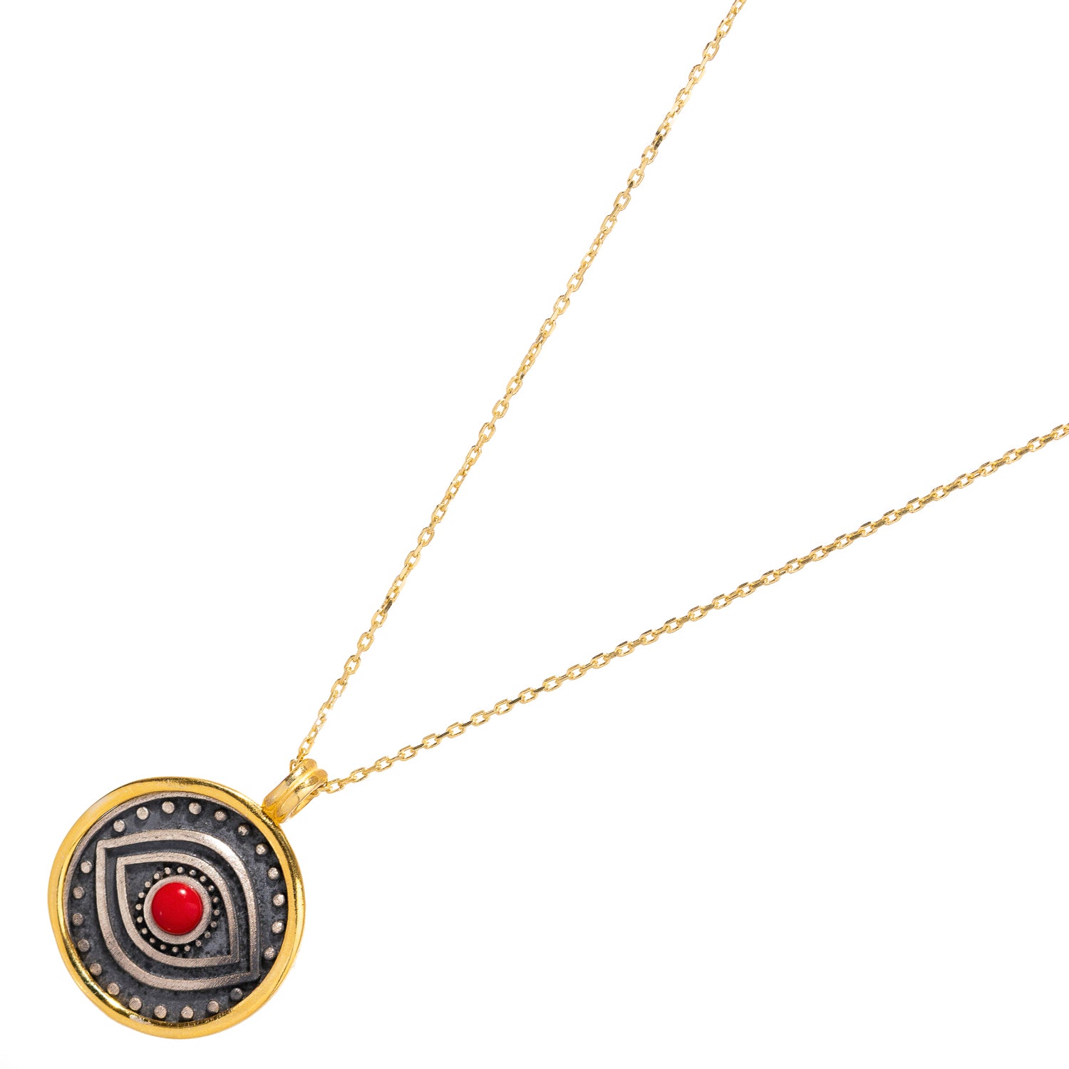 Delicate sterling silver necklace with a red coral evil eye pendant and gold vermeil border, symbolizing protection, passion, and strength.