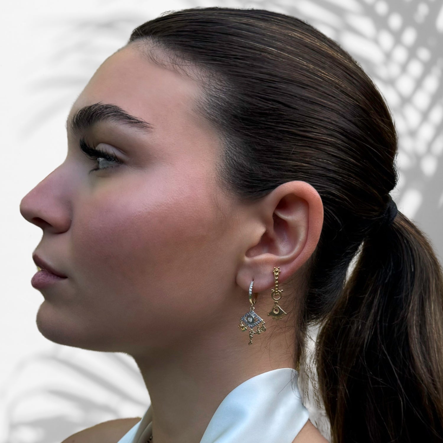 Model Radiating Positive Vibes in Peace & Love Gold Earrings