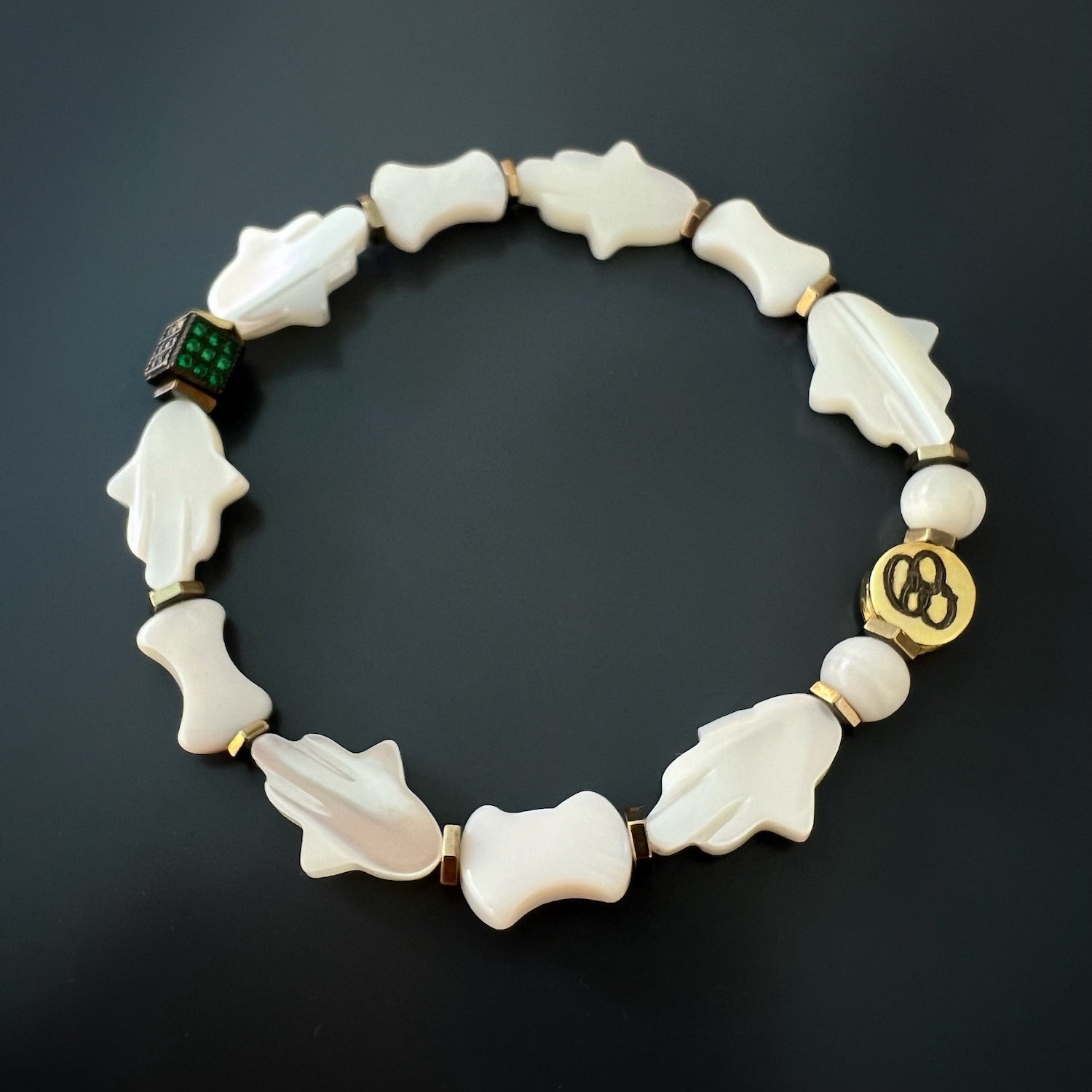 Pearl Hamsa Hand Bracelet, a unique and meaningful accessory combining traditional symbolism and modern design.