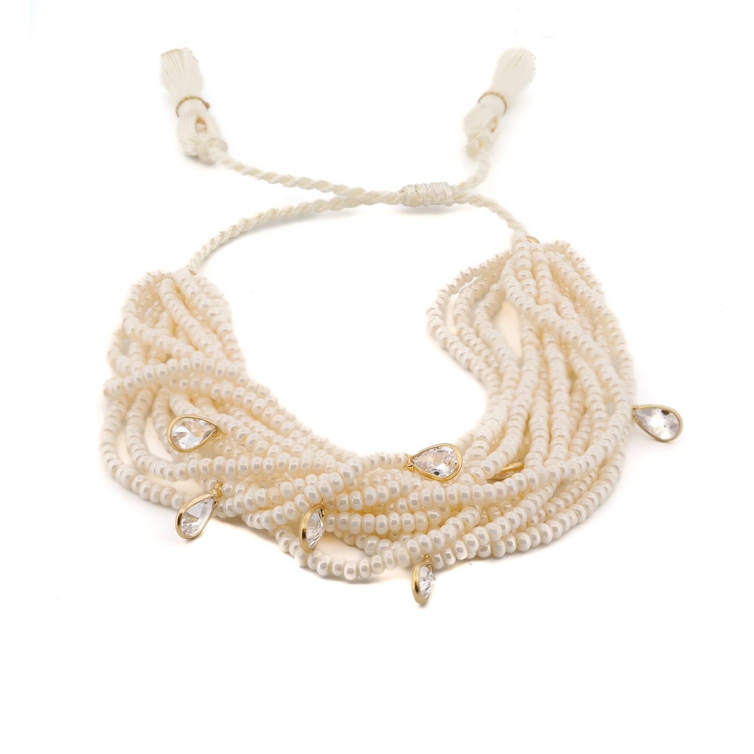 Handcrafted multi-strand white pearl bracelet with sterling silver and Swarovski teardrop charms