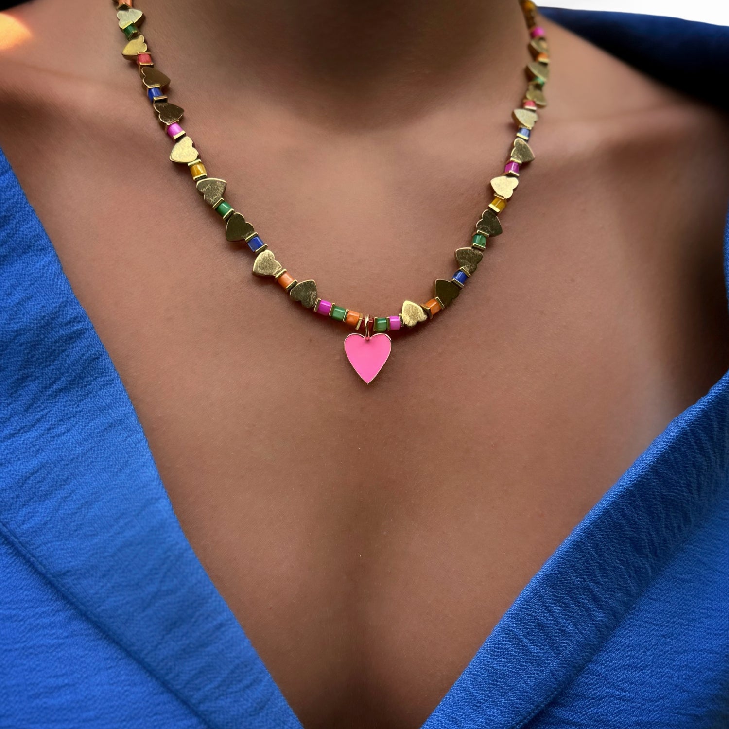 Model Wearing Gold Hematite Heart Beaded Necklace with Pink Enamel Pendant