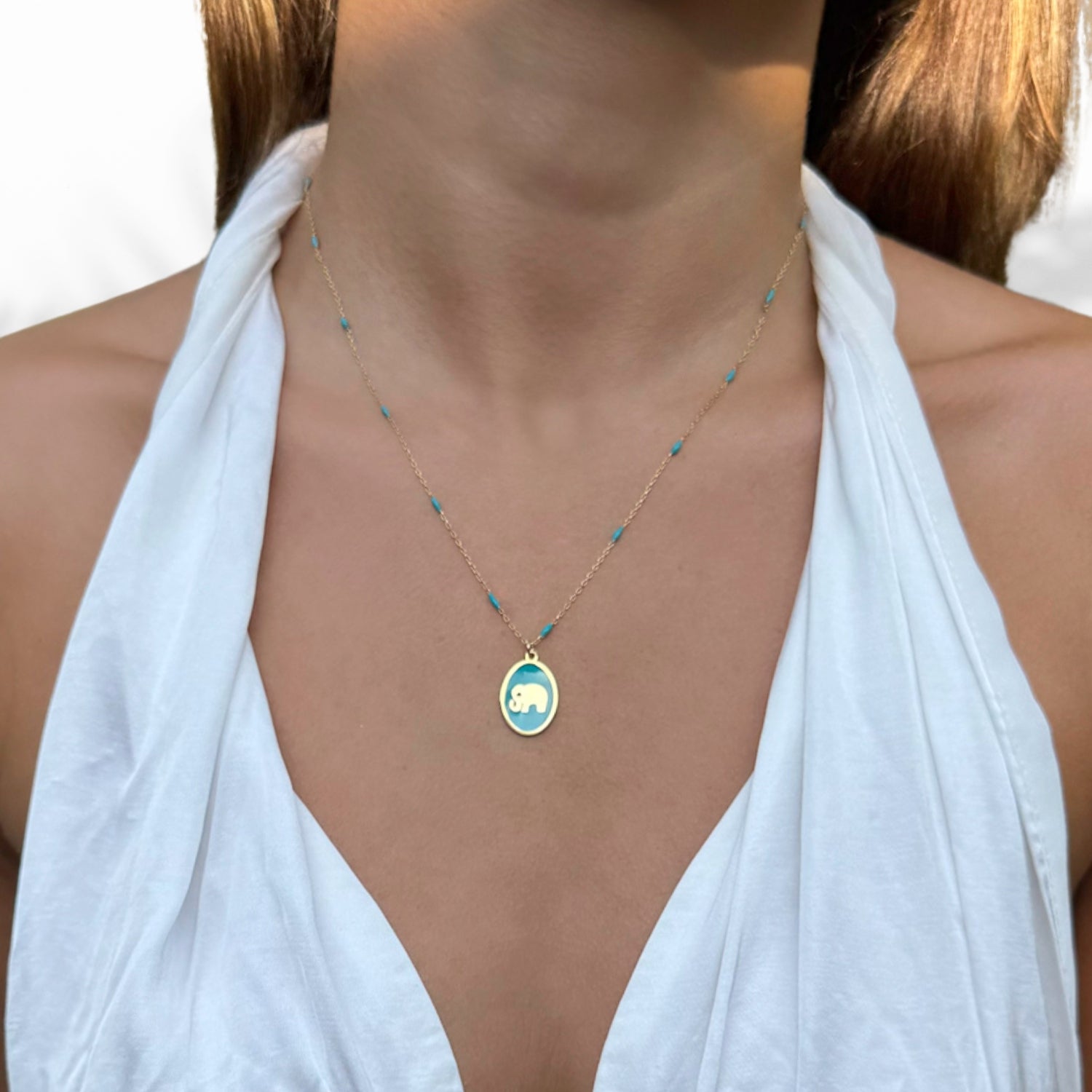 Model Wearing Meaningful Elephant Pendant Necklace with Turquoise Enamel Chain