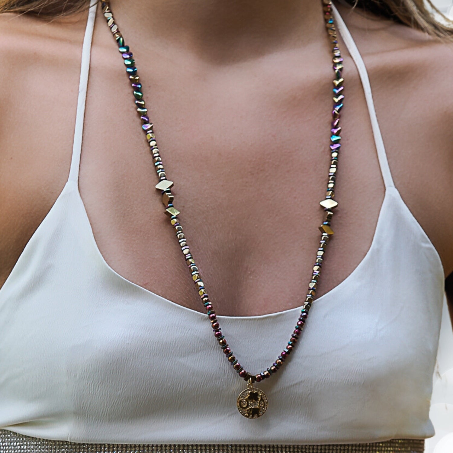 Symbols of Wisdom, Luck, and Immortality Grace the Model's Neck.