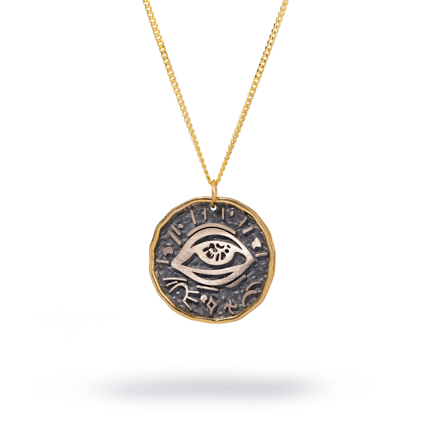 Sterling silver pendant necklace with a protective eye symbol framed in 18k gold plating for warding off negativity.