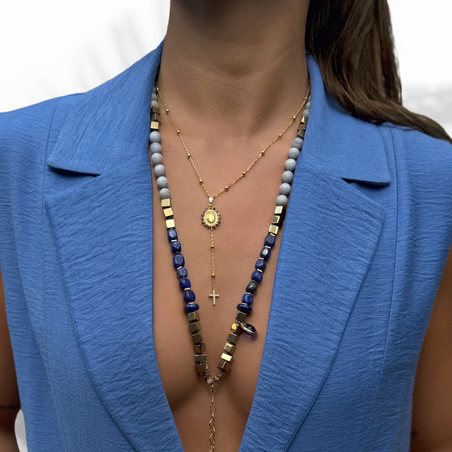 Model Wearing Handcrafted Virgin Mary Pendant Necklace with Sapphires and Diamonds