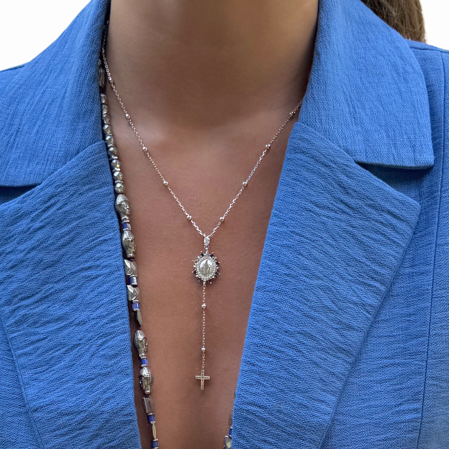 Model Wearing Handcrafted Virgin Mary Pendant Necklace with Sapphires and Diamonds
