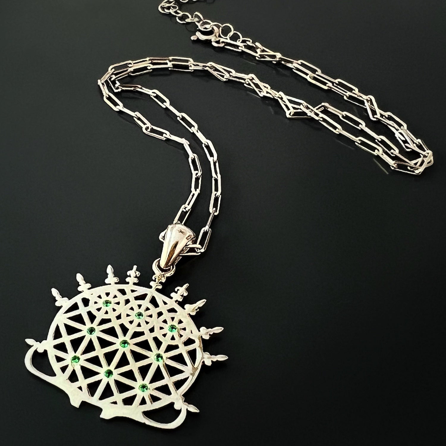 The Silver Hittite Sun Disc Necklace, a versatile piece that can be worn for both casual and formal occasions, adding a touch of elegance and significance to any outfit.