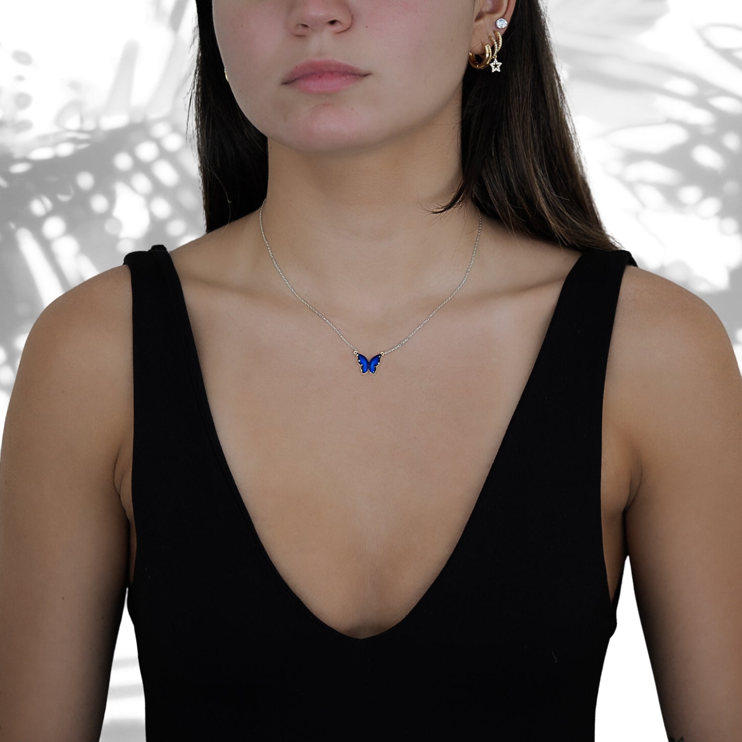 Stylish shot of a model wearing the Silver Spiritual Blue Enamel Butterfly Necklace, showcasing its spiritual and aesthetic appeal.