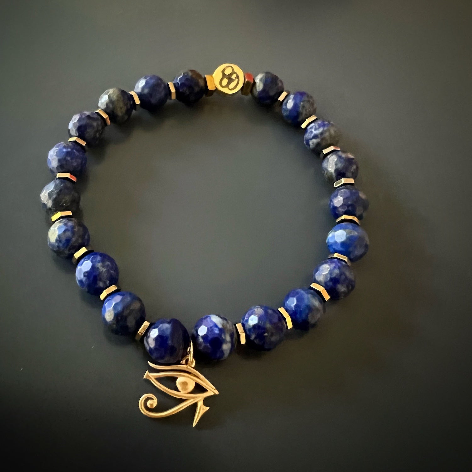 Experience the deep connection to ancient wisdom with the Solid Gold Eye of Ra Spiritual Beaded Bracelet, adorned with lapis lazuli stones and a mesmerizing solid gold charm.