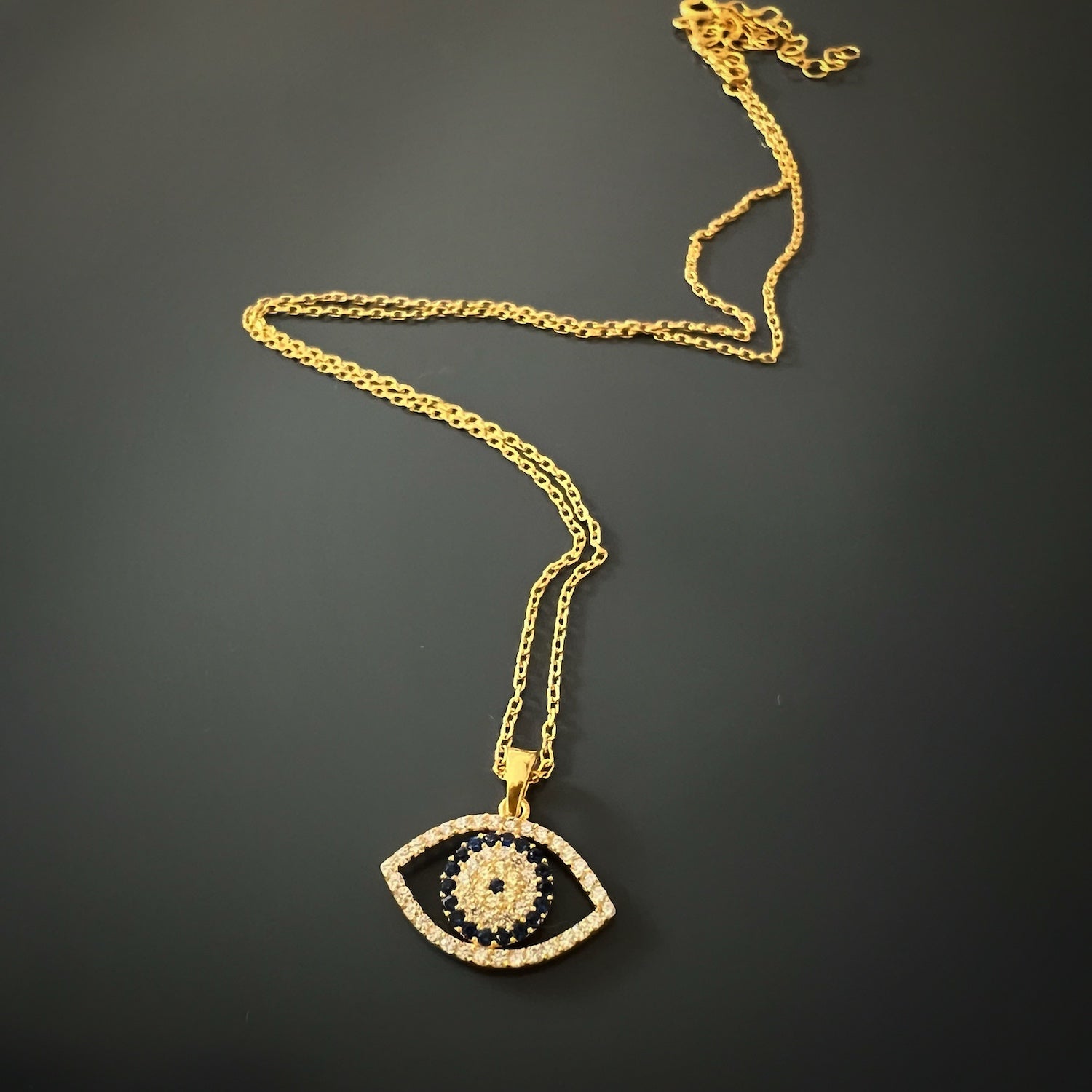 A detailed shot of the sparkling CZ diamonds on the evil eye pendant of the Sparkly Evil Eye Necklace.