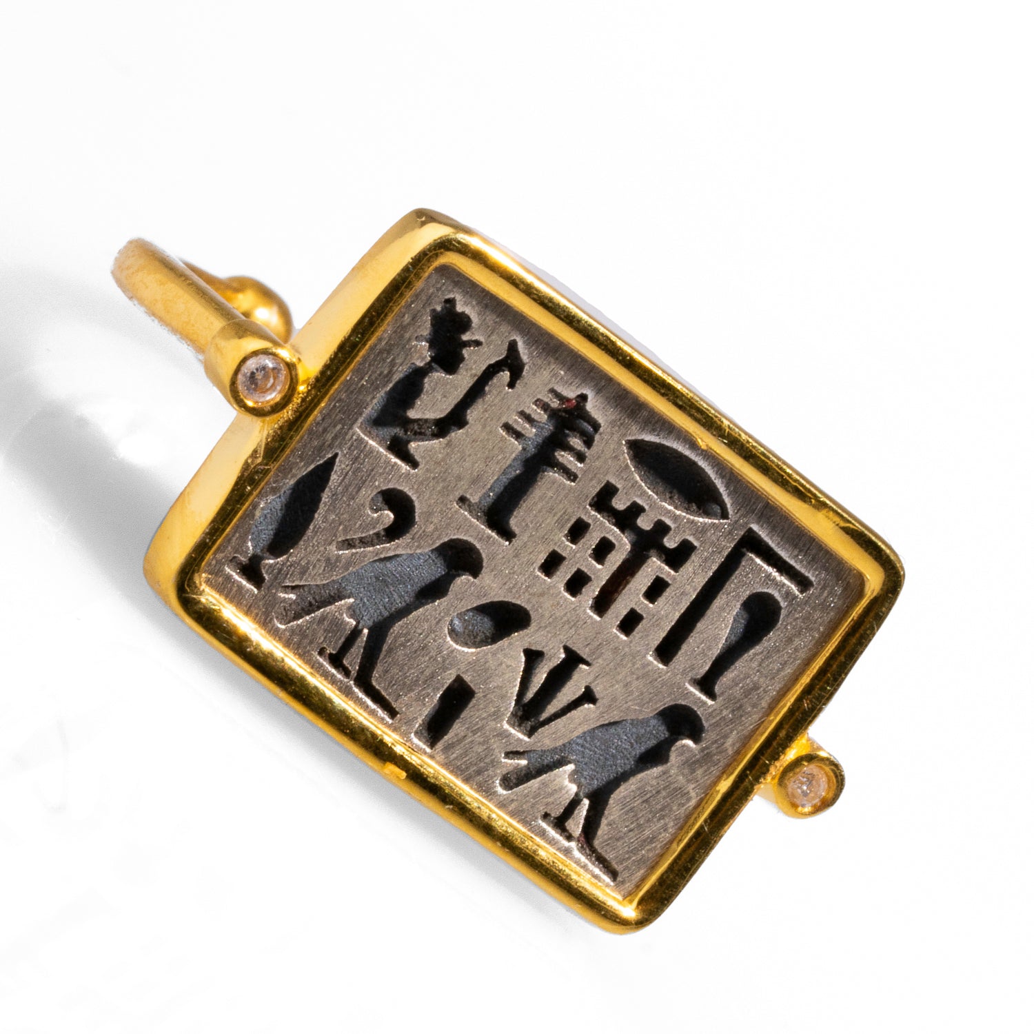 Sophisticated ring with a rectangular sterling silver plate engraved with Egyptian symbols, complemented by an 18k gold-plated border, adjustable from size 5.5 to 9.