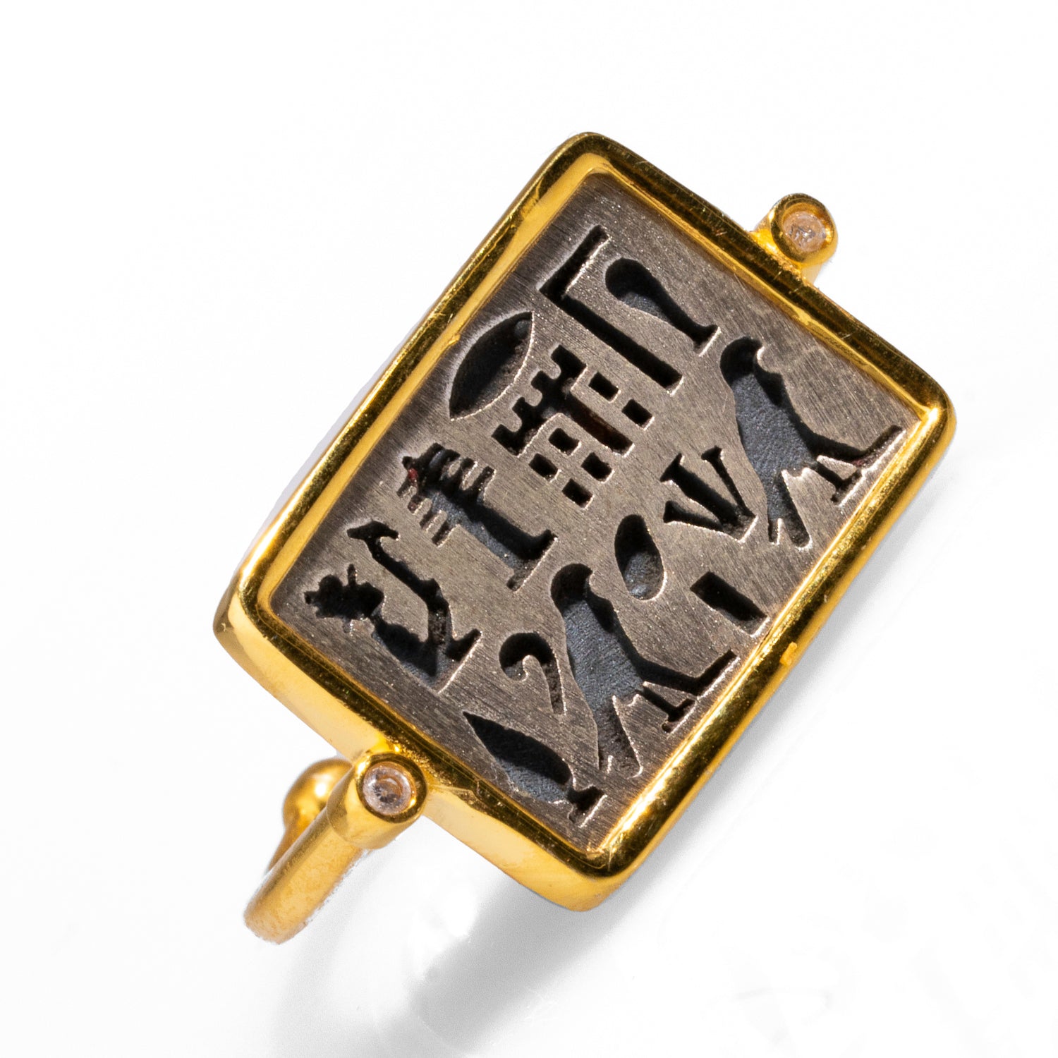 Rectangular sterling silver ring featuring intricate Egyptian symbols and a gold-plated frame, adjustable from size 5.5 to 9.