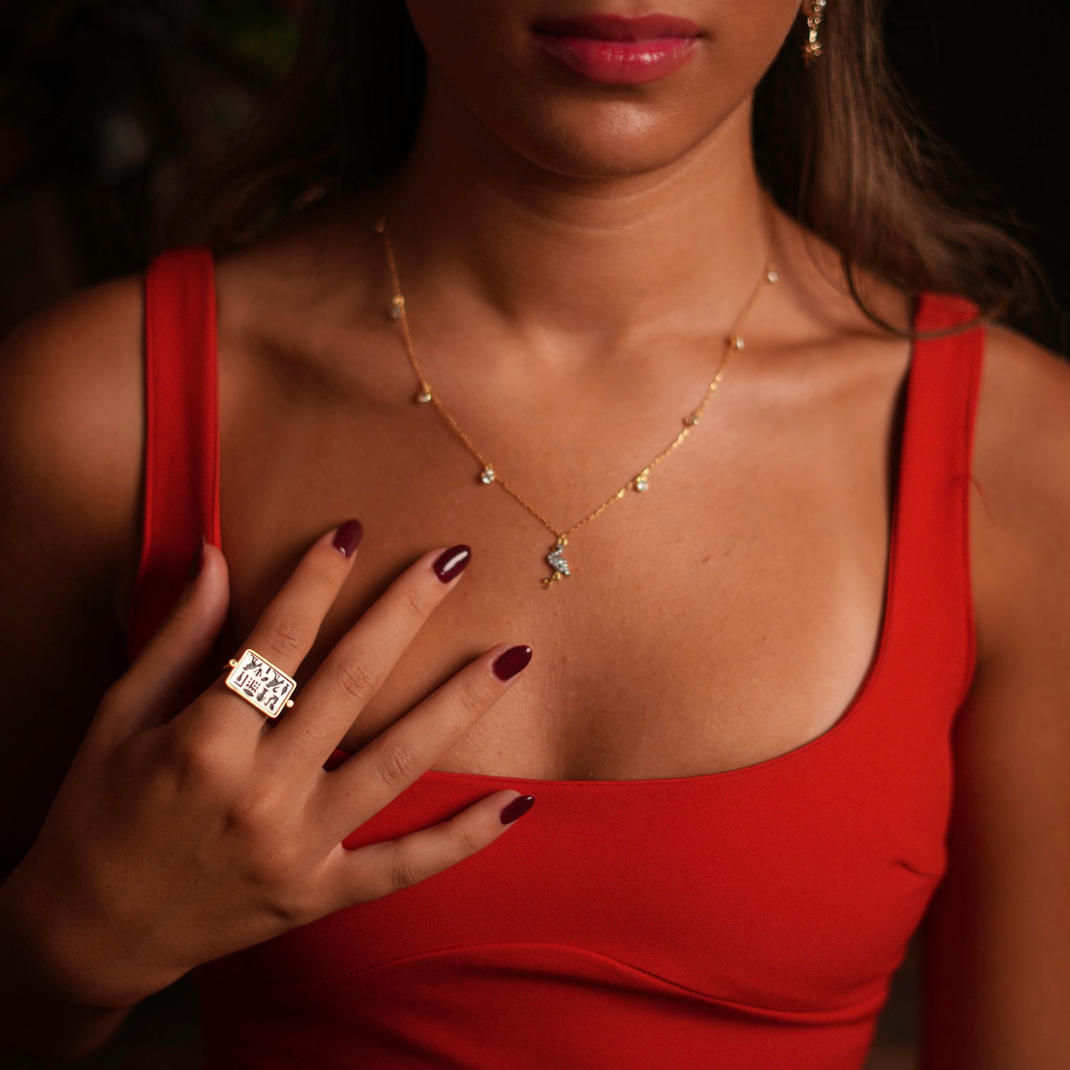 Meaningful adjustable ring with spiritual Egyptian symbols on a sterling silver plate, finished with an 18k gold border, adjustable from size 5.5 to 9.