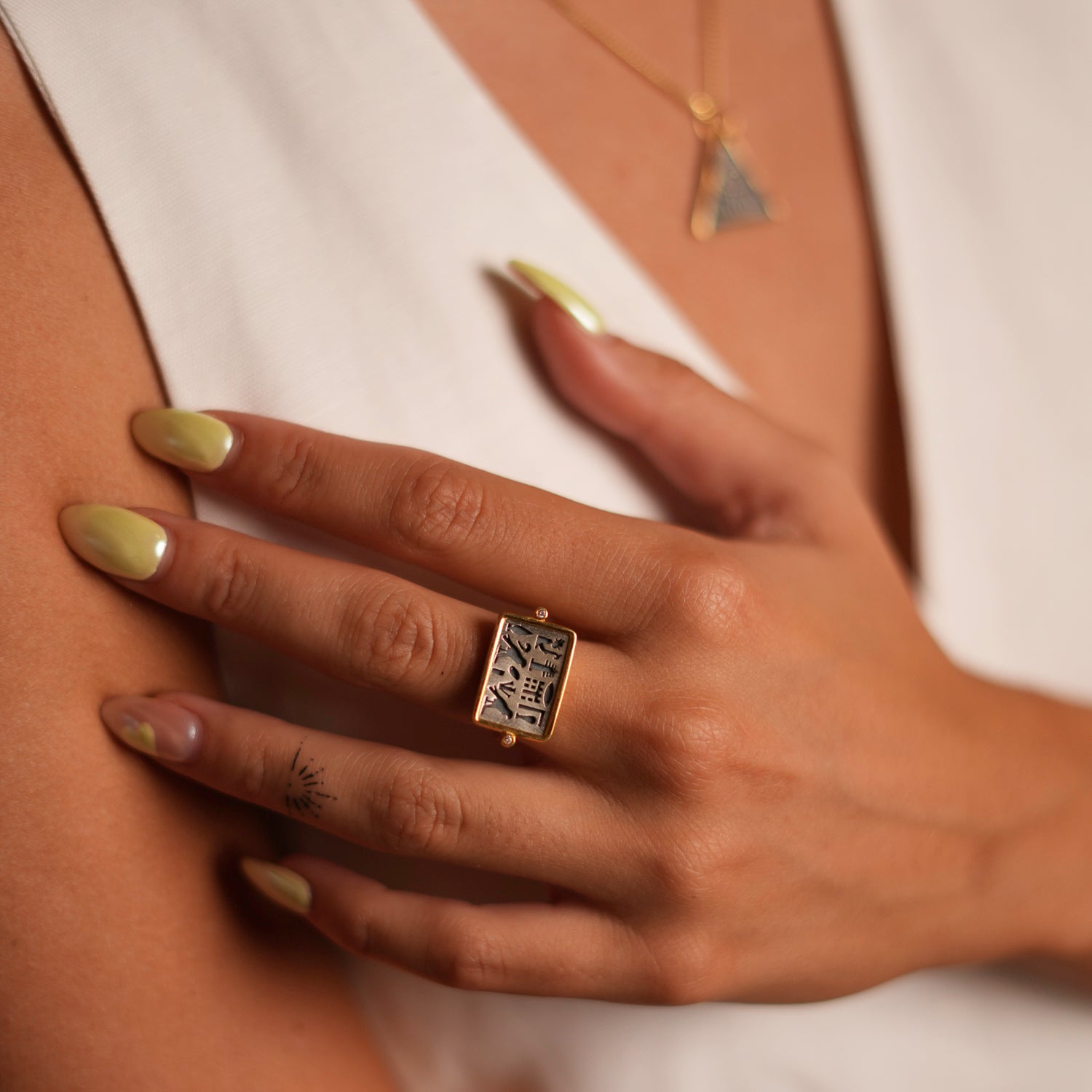 Unique adjustable ring featuring spiritual Egyptian symbols on a sterling silver plate, framed with gold vermeil, adjustable from size 5.5 to 9.