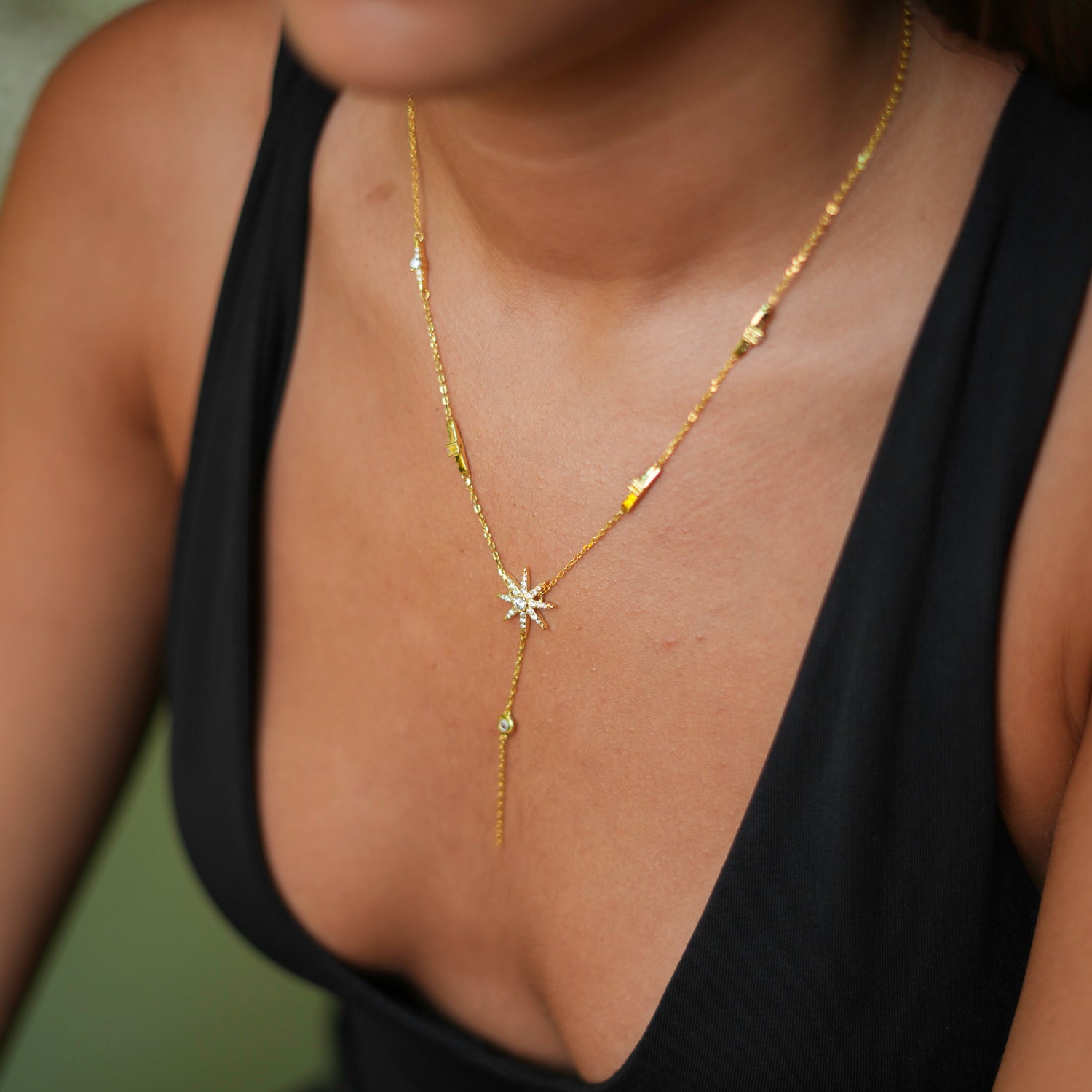 Radiant 18K gold-plated sterling silver necklace with a star charm and diamond embellishments, designed for a touch of celestial elegance.