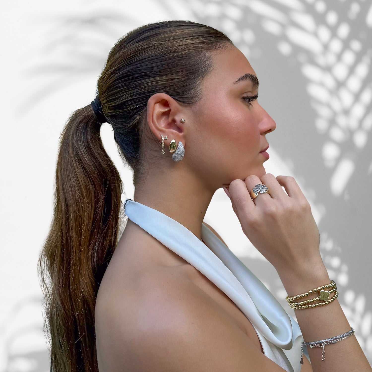 Model Displaying Elegance and Luxury in Sterling Silver Drop Earrings