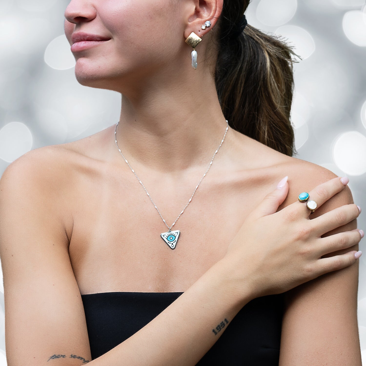 Model Wearing Sterling Silver Turquoise Evil Eye Chakra Necklace - Elegance and protection.