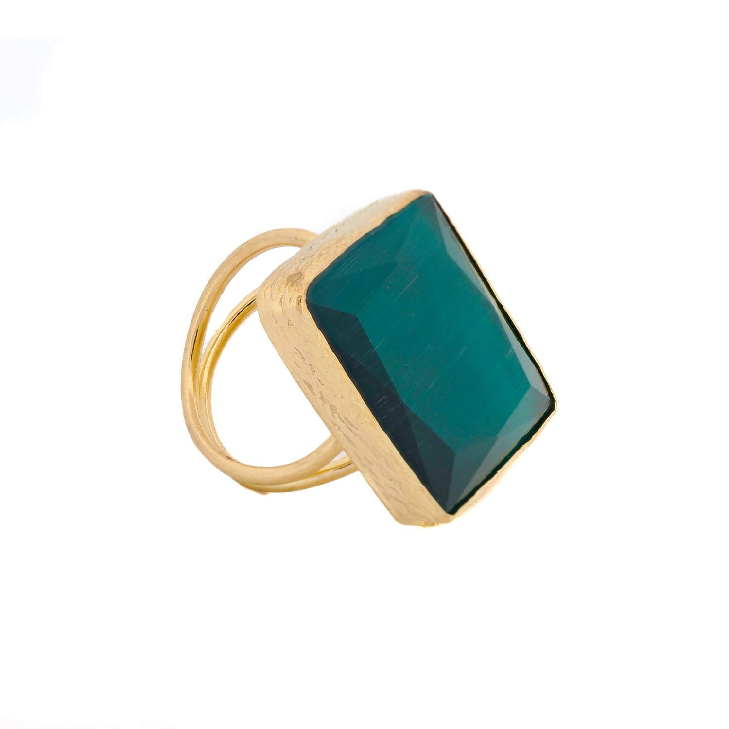 Gold-plated brass ring with a chunky green cat eye stone, reflecting light with a cat-eye effect