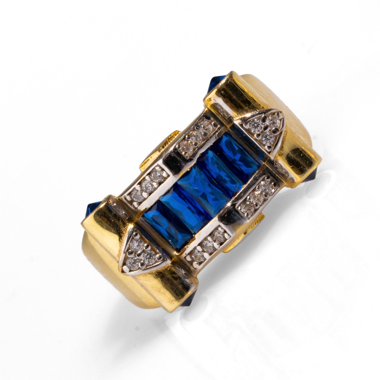 Gold statement ring with a sapphire stone surrounded by CZ diamonds