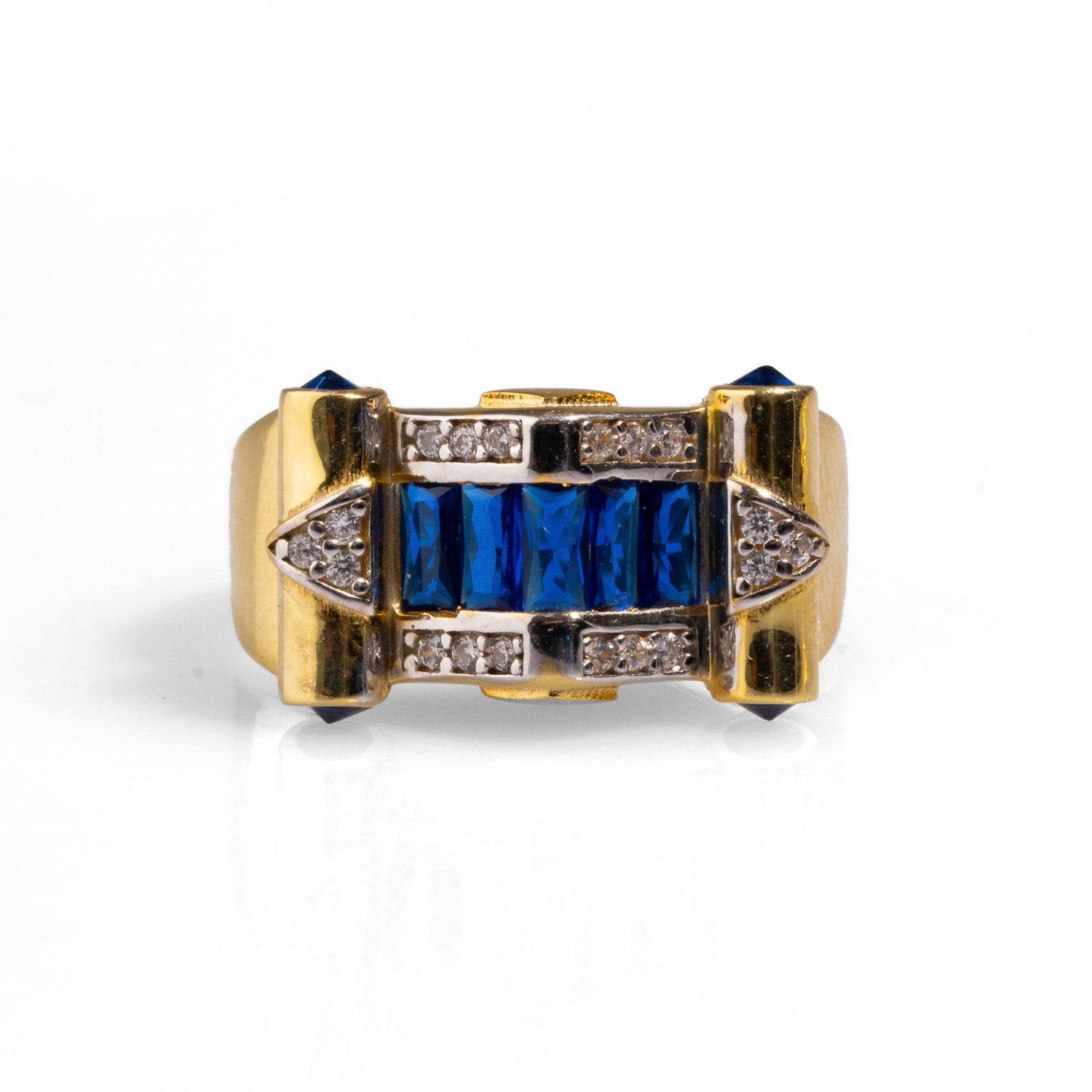 Gold statement ring with a sapphire center stone and CZ diamonds