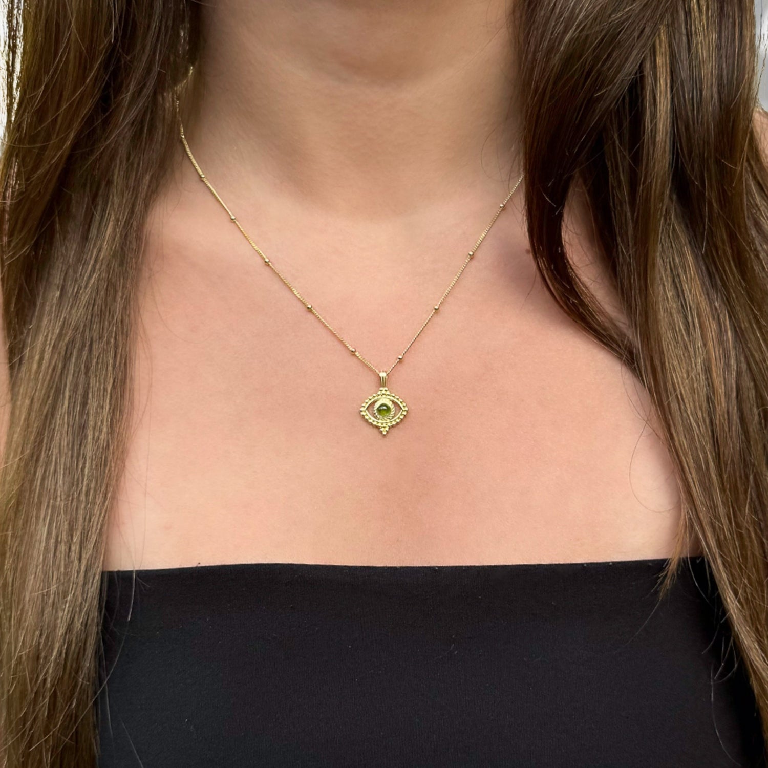 Thoughtful Design: Model Wearing Evil Eye Necklace for Good Luck