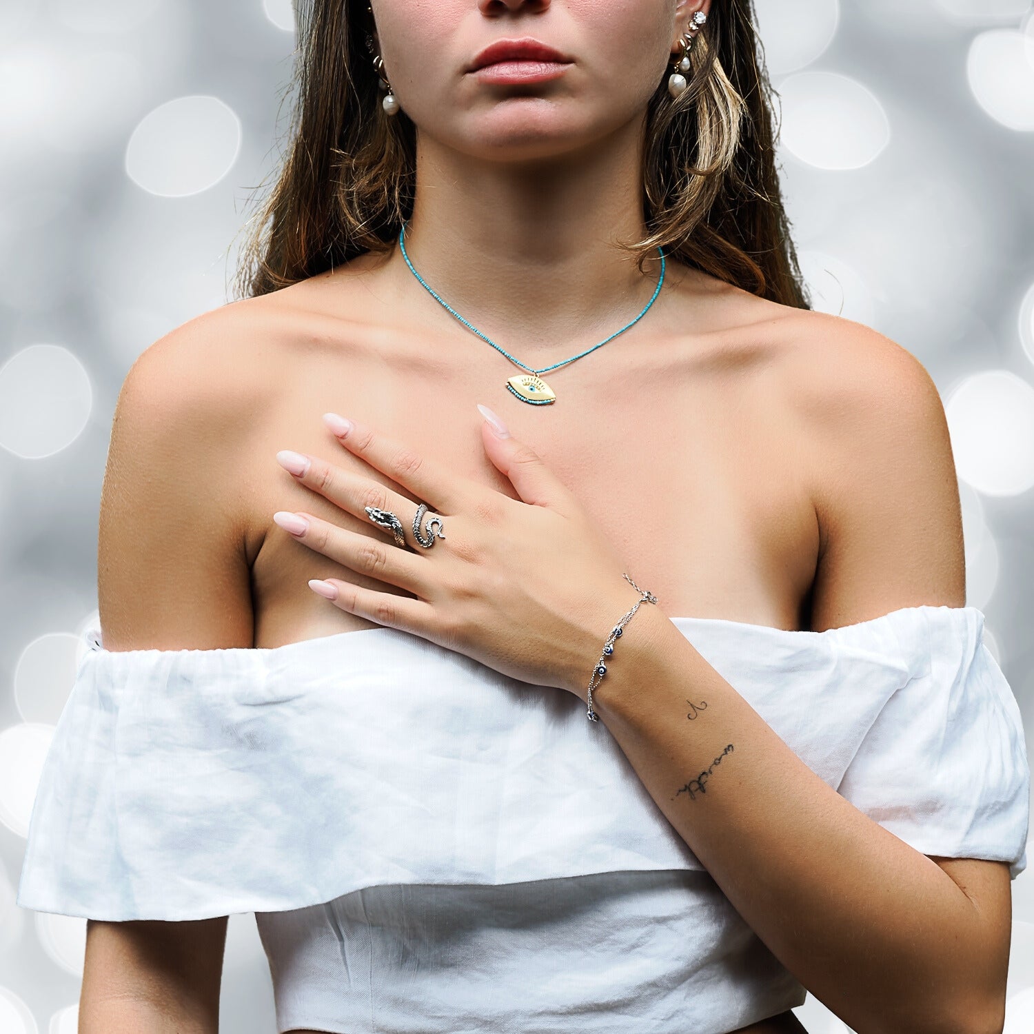 Embrace spirituality: Model adorns Evil Eye Silver Bracelet.