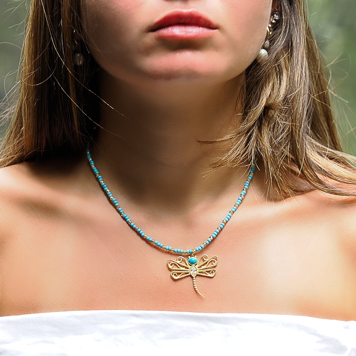 Radiate Tranquility - Model Wearing Turquoise Dragonfly Necklace.