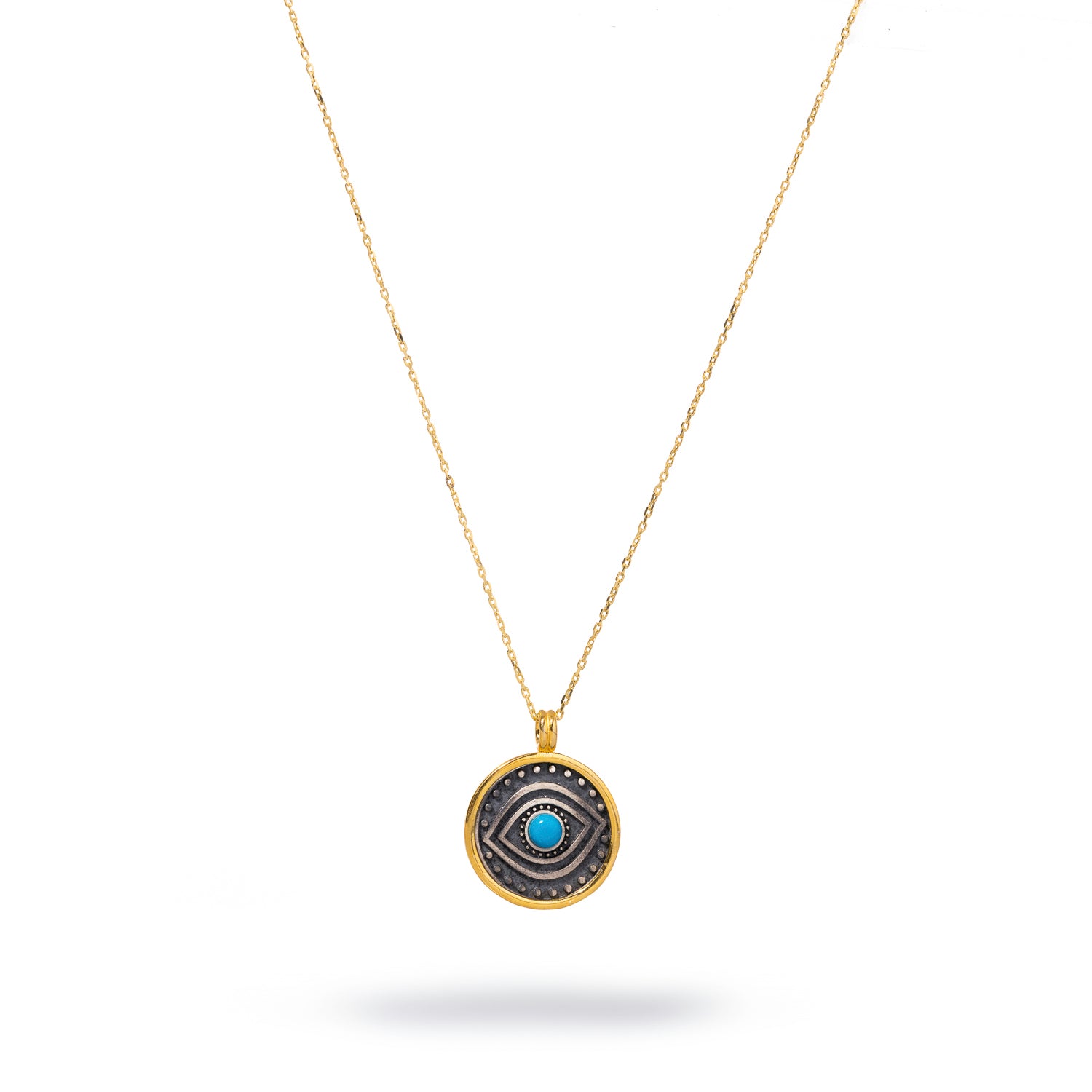 Stylish necklace with a turquoise evil eye set in a sterling silver pendant, encircled by dot symbols and framed with 18k gold plating for added elegance.