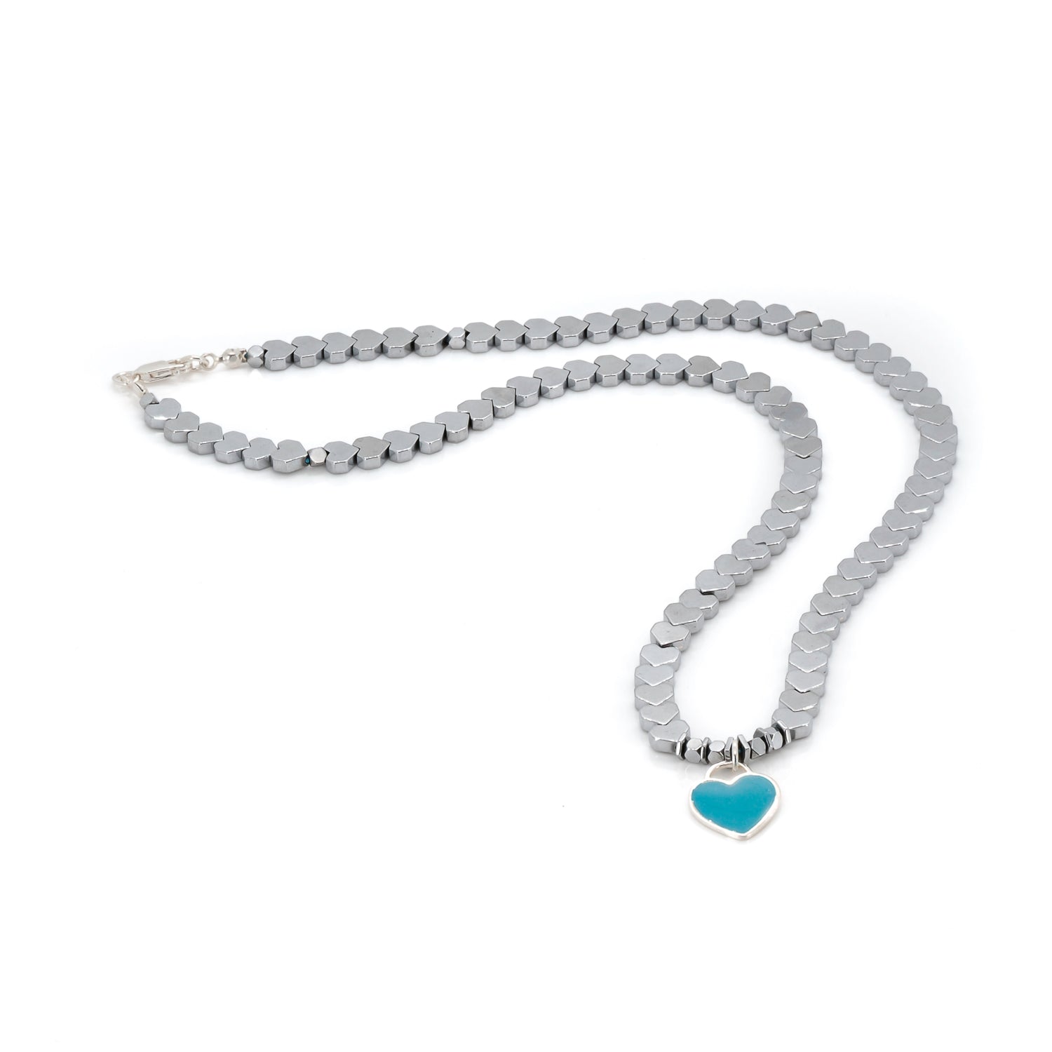 Handcrafted Silver Hematite Necklace with a turquoise heart pendant, designed for grounding energy and style